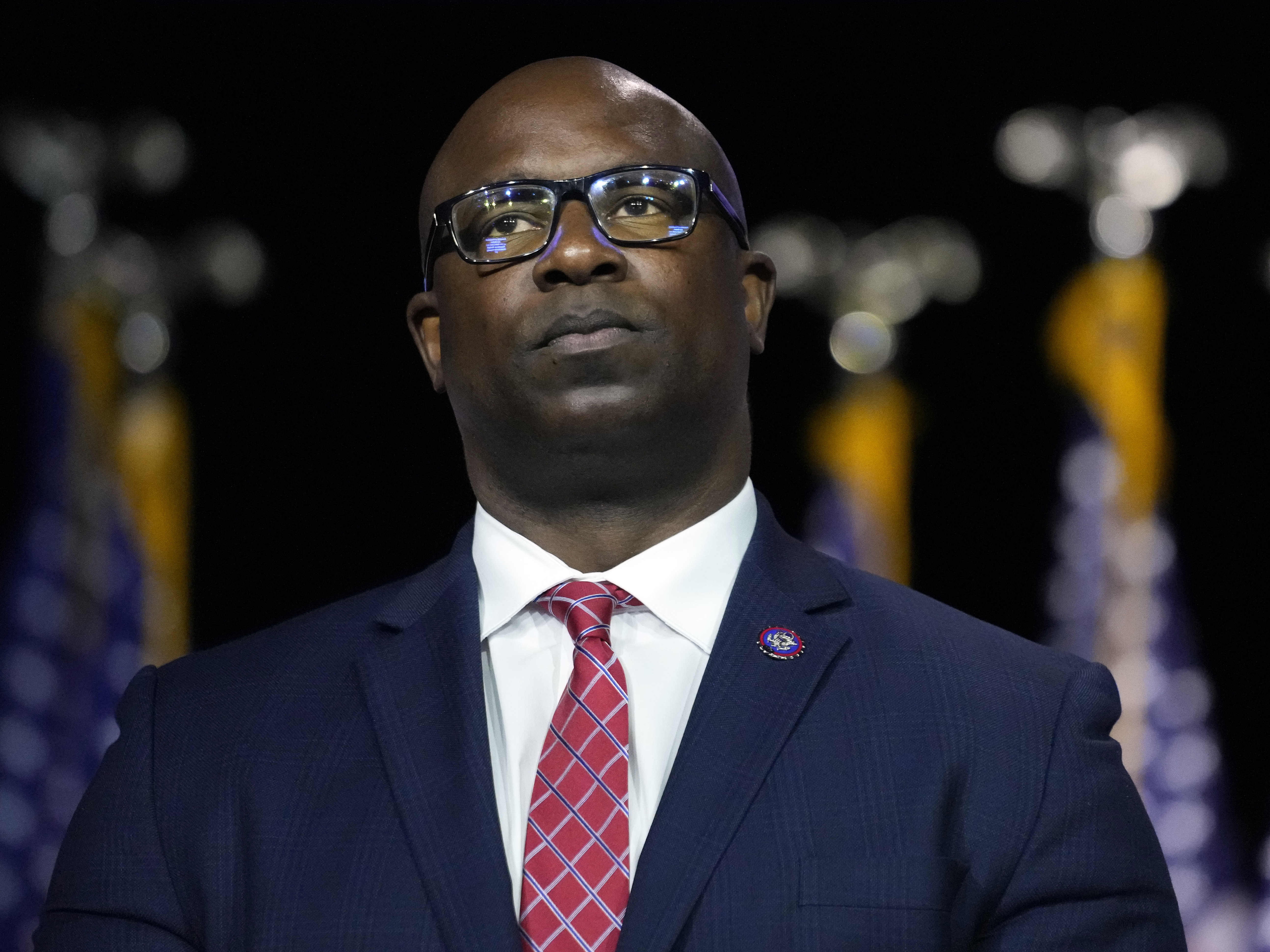 caption: Rep. Jamaal Bowman, D-N.Y., listens to fellow speakers before President Joe Biden speaks during an event at SUNY Westchester Community College, May 10, 2023, in Valhalla, N.Y.
