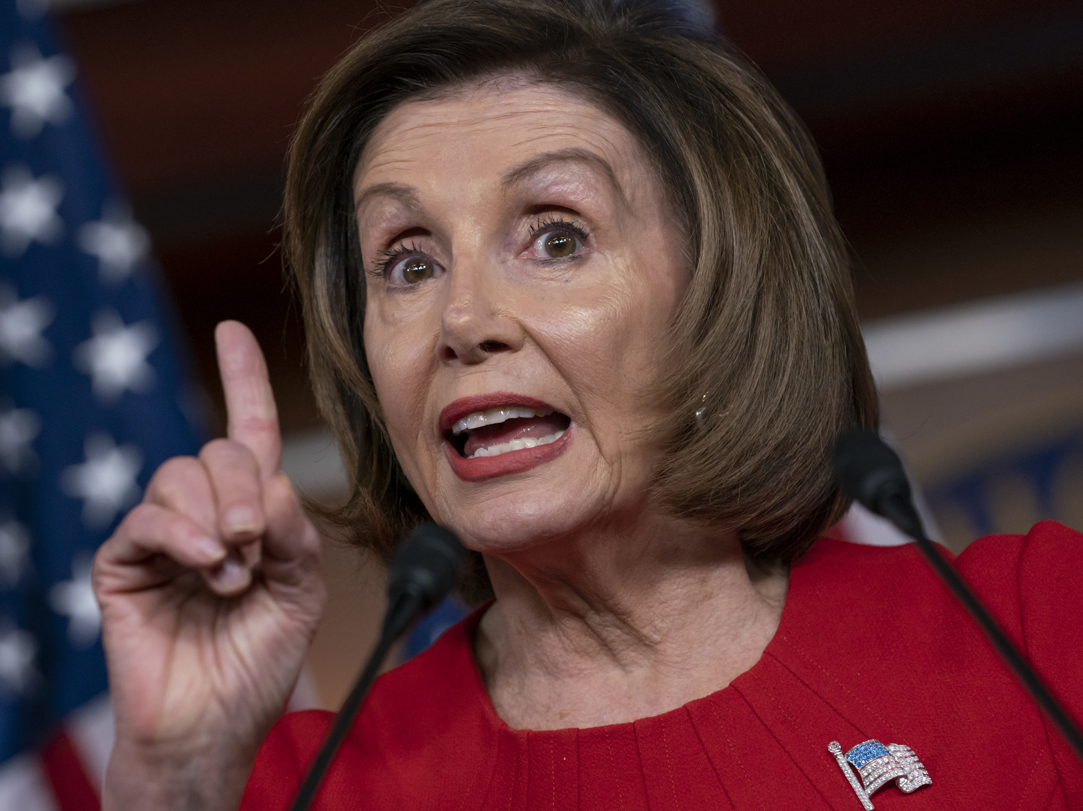 caption: Speaker of the House Nancy Pelosi, D-Calif., talks to reporters Thursday on Capitol Hill.