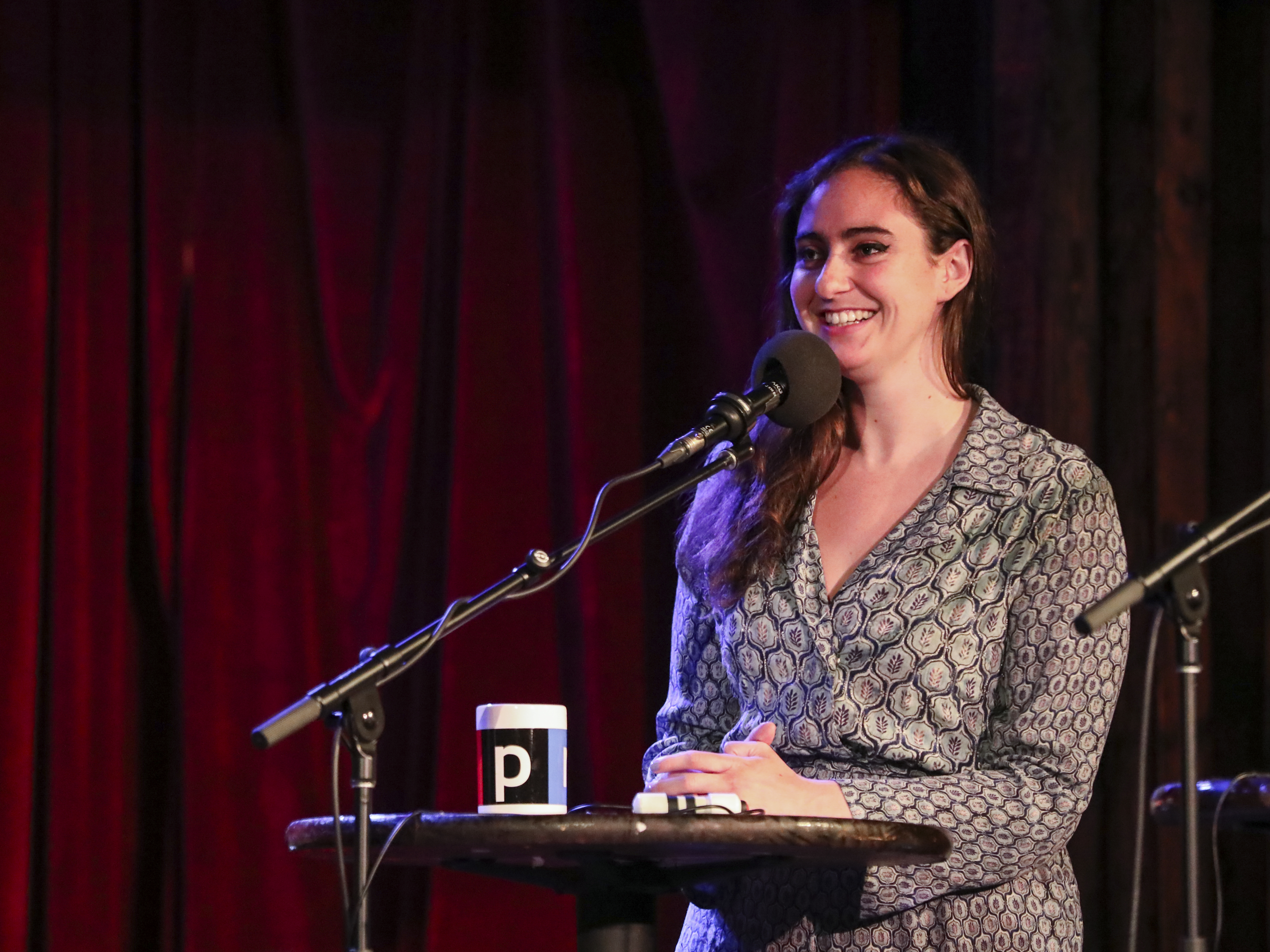 caption: Catherine Cohen appears on Ask Me Another at the Bell House in Brooklyn, New York.