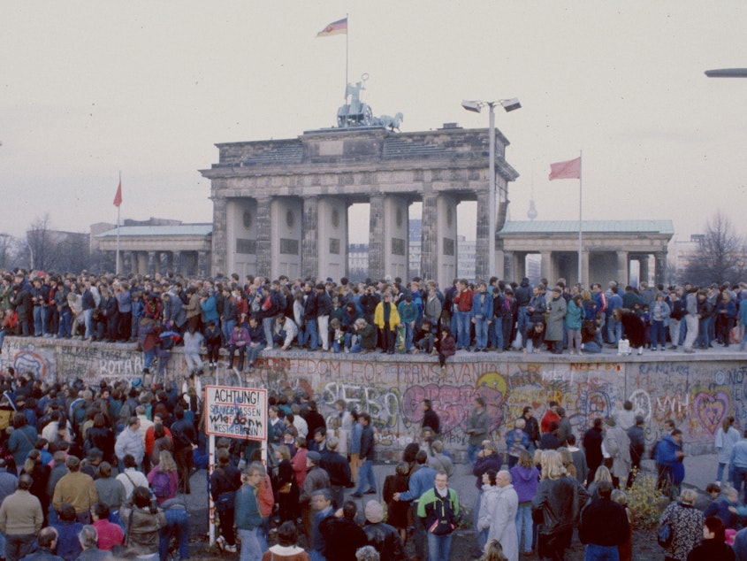 caption: In front of the Brandenburg Gate on Nov. 10, 1989.