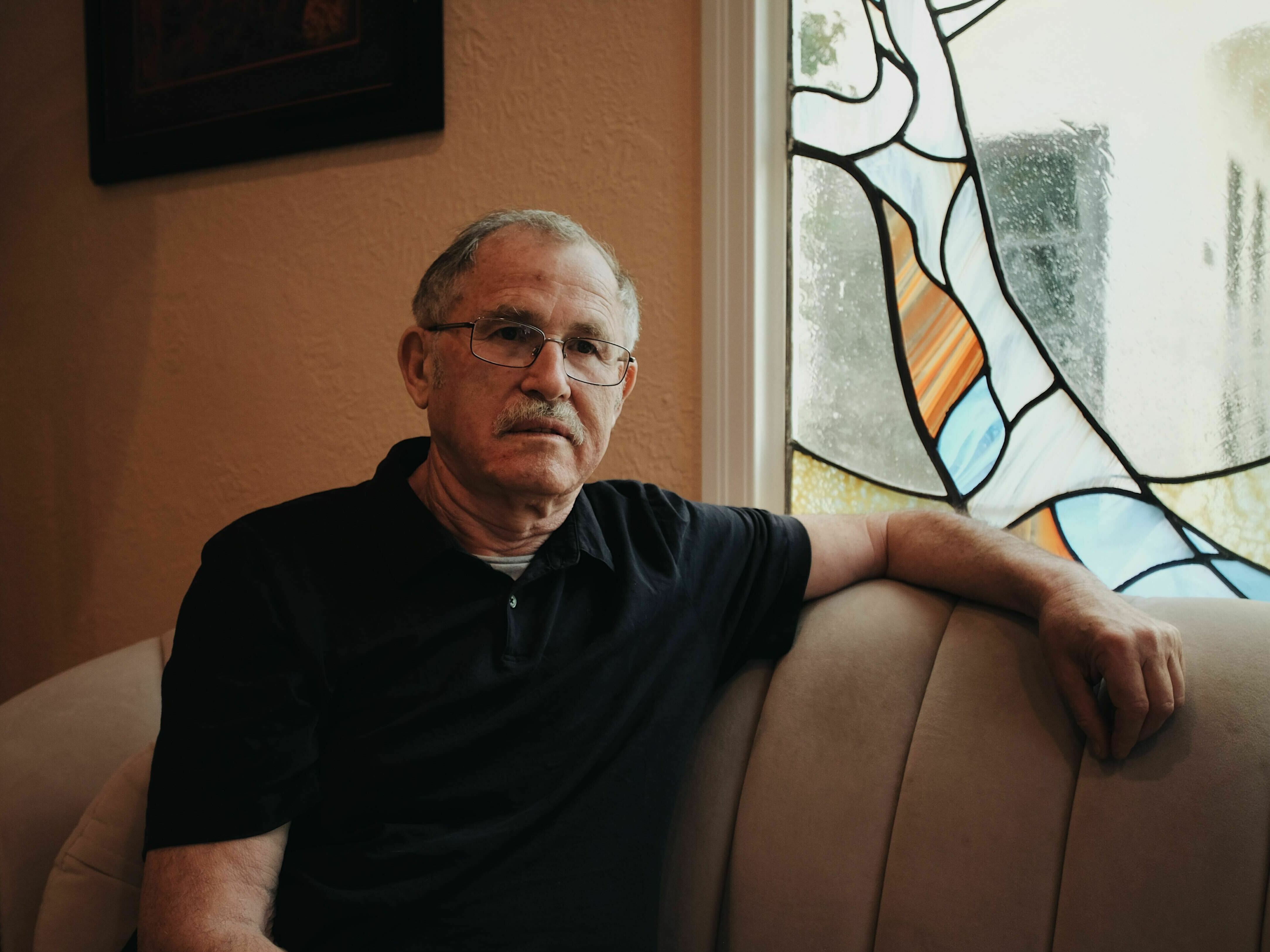 caption: Naum Lantsman in his Los Angeles home. He fell victim to a cryptocurrency scam and ended up losing his entire life savings.