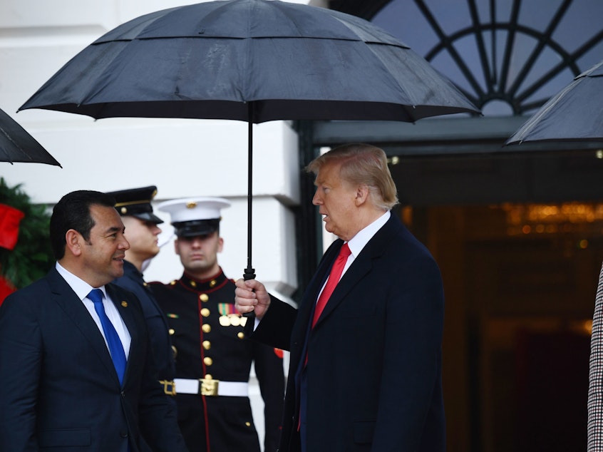 caption: "You are the ones bringing pain and suffering to our Republic for your own selfish personal, political, and partisan gain," President Trump said of Democrats in a letter to House Speaker Nancy Pelosi on Tuesday. Above, Trump greets Guatemalan President Jimmy Morales at the White House on Tuesday.