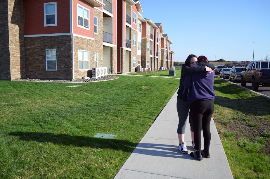 caption: Sarah Nenema and her 14-year-old daughter Shayna are portrayed hugging near where Shayna lives outside Spokane, on Thursday, April 24, 2025.