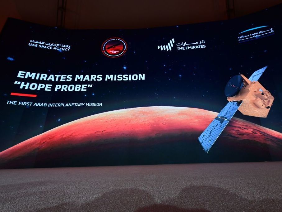 caption: A picture taken on July 19, 2020, shows a screen broadcasting the launch of the "Hope" Mars probe at the Mohammed Bin Rashid Space Centre in Dubai. "Hope" — Al-Amal in Arabic — is expected to start orbiting Mars this week, marking the 50th anniversary of the unification of the UAE.