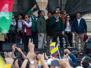 caption: Colombian President Gustavo Petro (center right) attends an International Workers' Day rally in Bogotá, Colombia, on Wednesday.