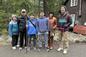 caption: Leo Yang (center right) and his extended family at Mount Rainier National Park, April 9, 2024