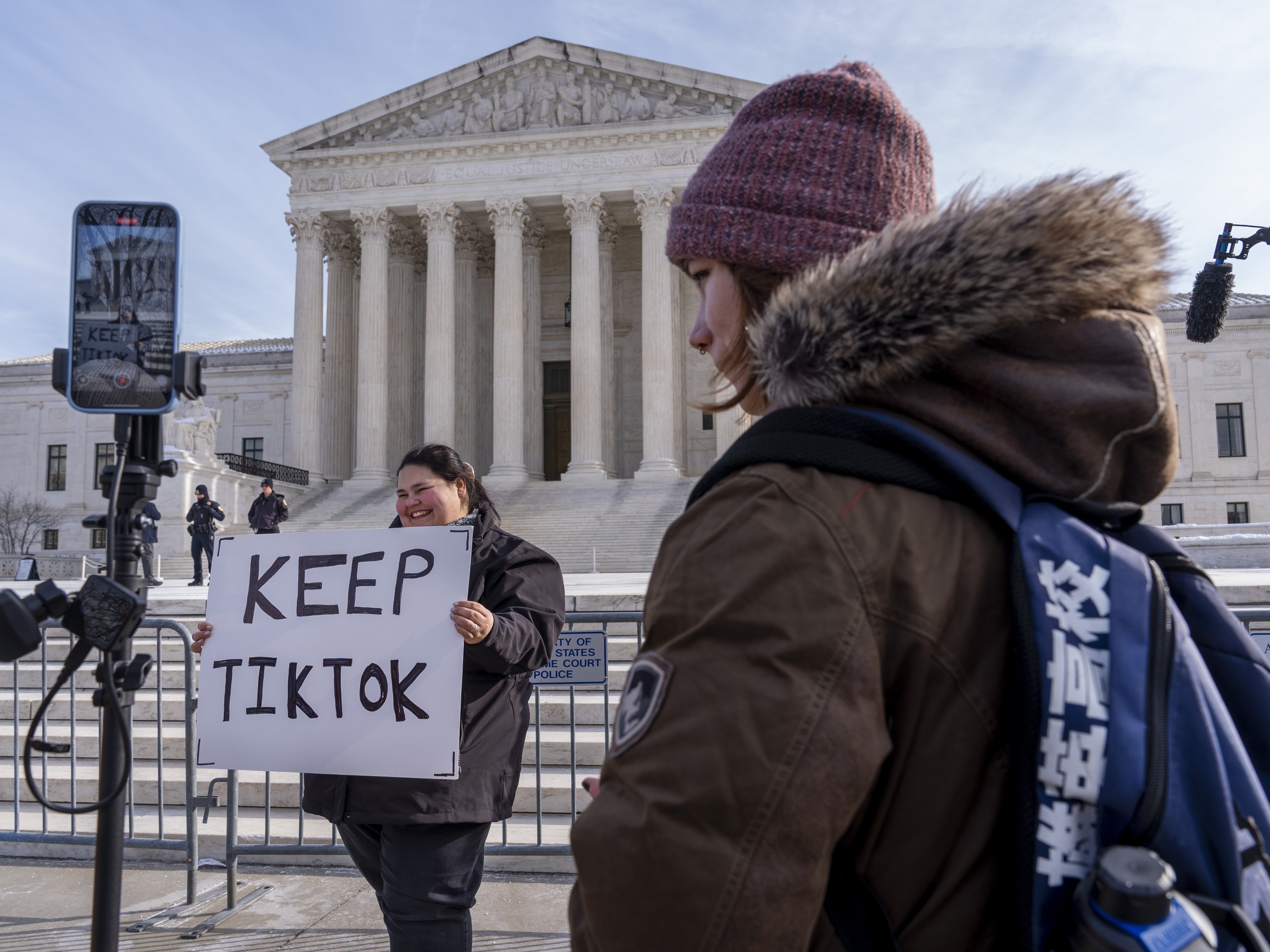 caption: Callie Goodwin of Columbia, S.C., holds a sign in support of TikTok outside the Supreme Court on Jan. 10 in Washington, D.C. Goodwin, a small-business owner who sells personalized greeting cards, says 80% of her sales come from people who found her on TikTok.