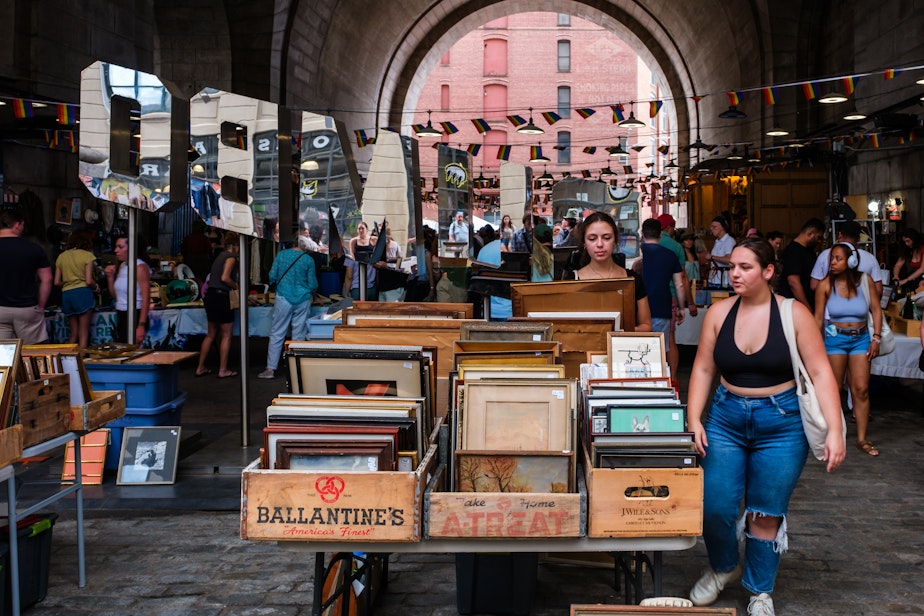 caption: A pop-up market located under the Manhattan Bridge at Dumbo Station in Brooklyn, New York City.