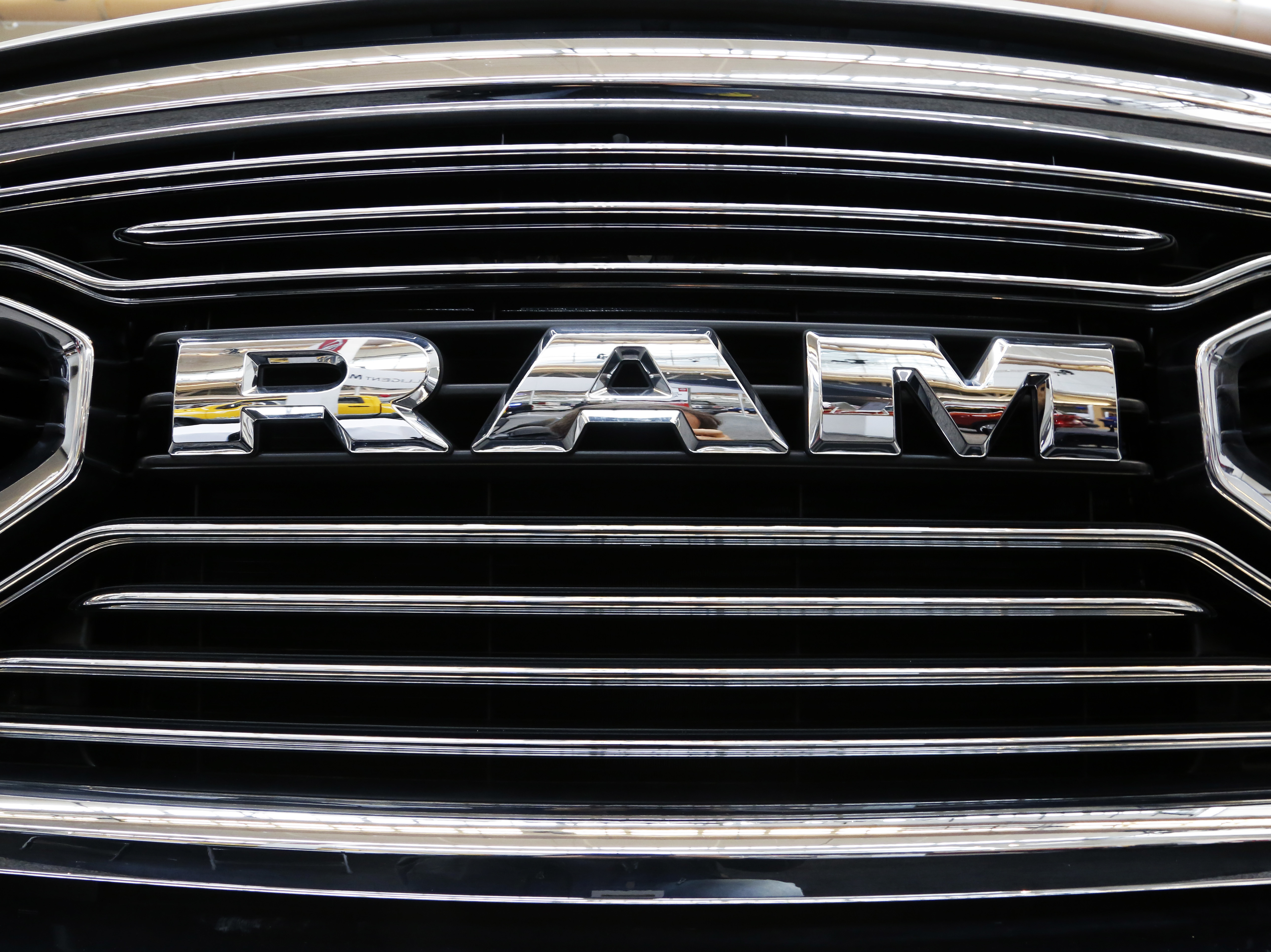 caption: This grill of a Ram truck is on display at the Pittsburgh Auto Show on Feb. 15, 2018. The Department of Justice released new details of a settlement with engine manufacturer Cummins Inc. on Wednesday that includes a mandatory recall of 600,000 Ram trucks.