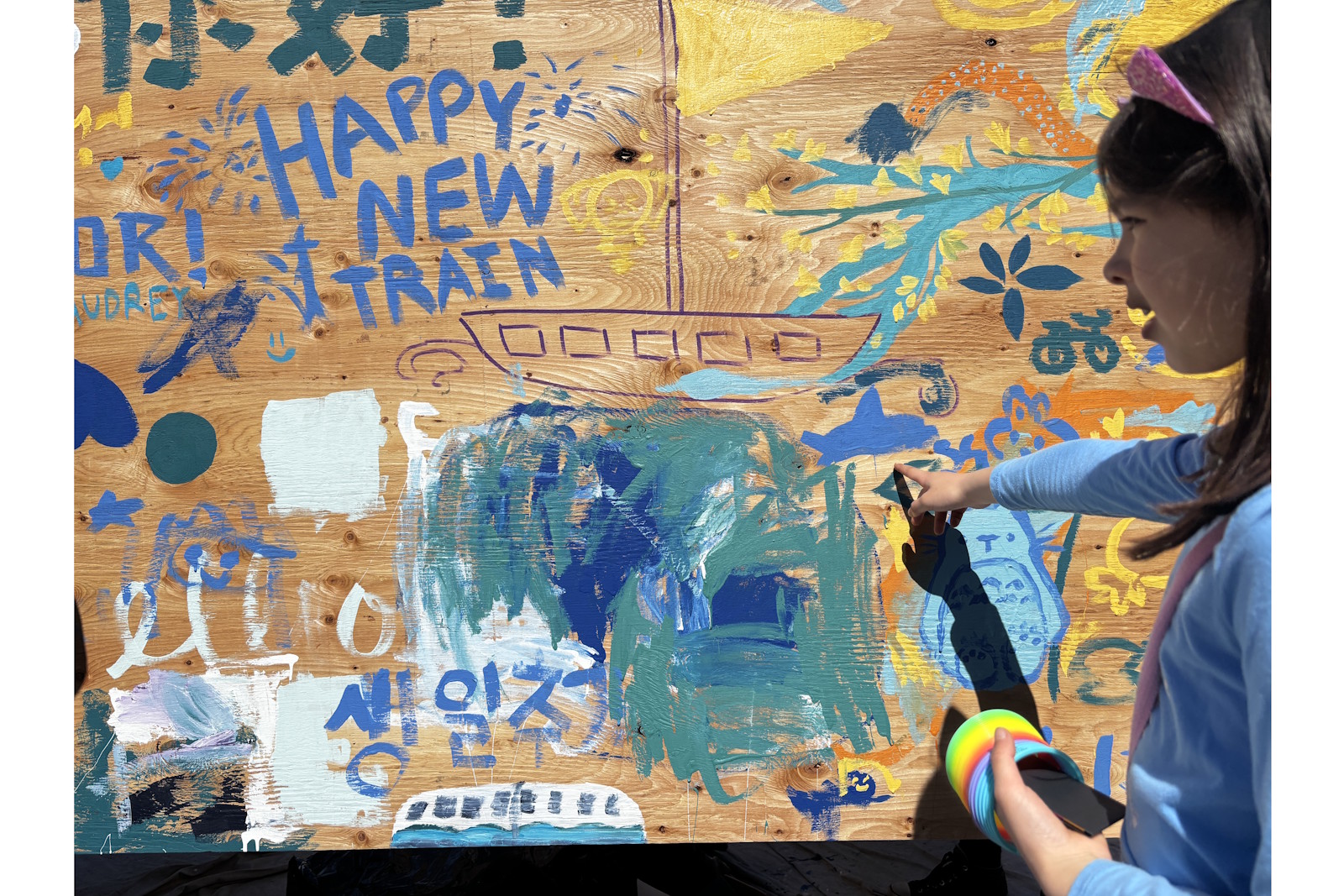 caption: A plywood painting activity was one of the activities on opening day at Judkins Park Station.
