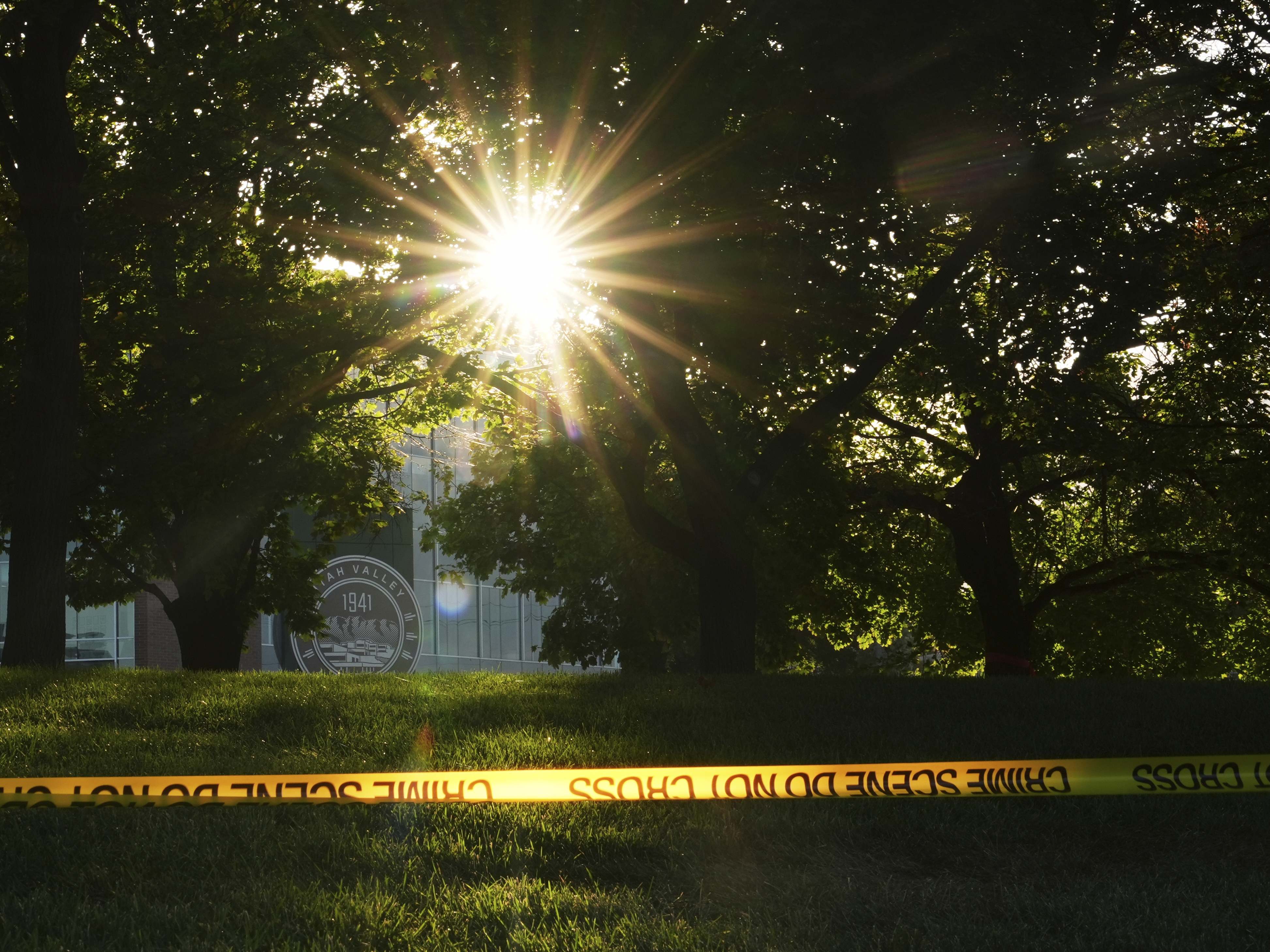 caption: Crime scene tape surrounds the perimeter of Utah Valley University after Turning Point USA CEO and co-founder Charlie Kirk was shot and killed , Saturday, Sept. 13, 2025, in Orem, Utah. Social media is promoting different views of why the shooter acted.
