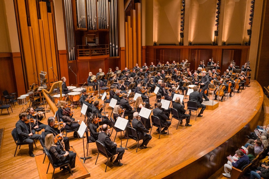 caption: Seattle Symphony musicians perform at Benaroya Hall with conductor Thomas Dausgaard