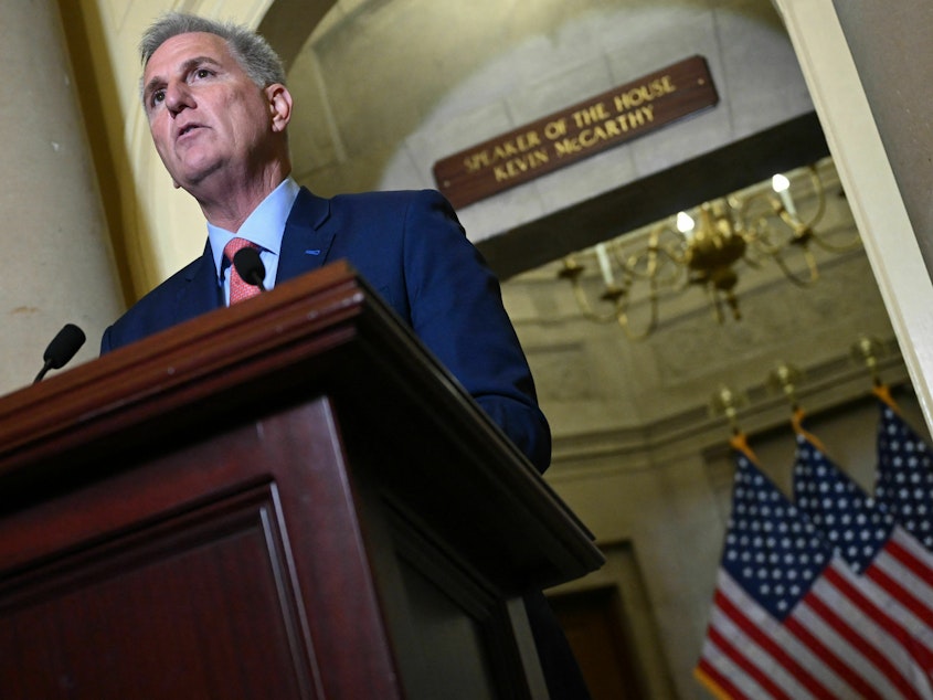 caption: Speaker of the House Kevin McCarthy speaks to reporters outside of his Capitol office on Tuesday.