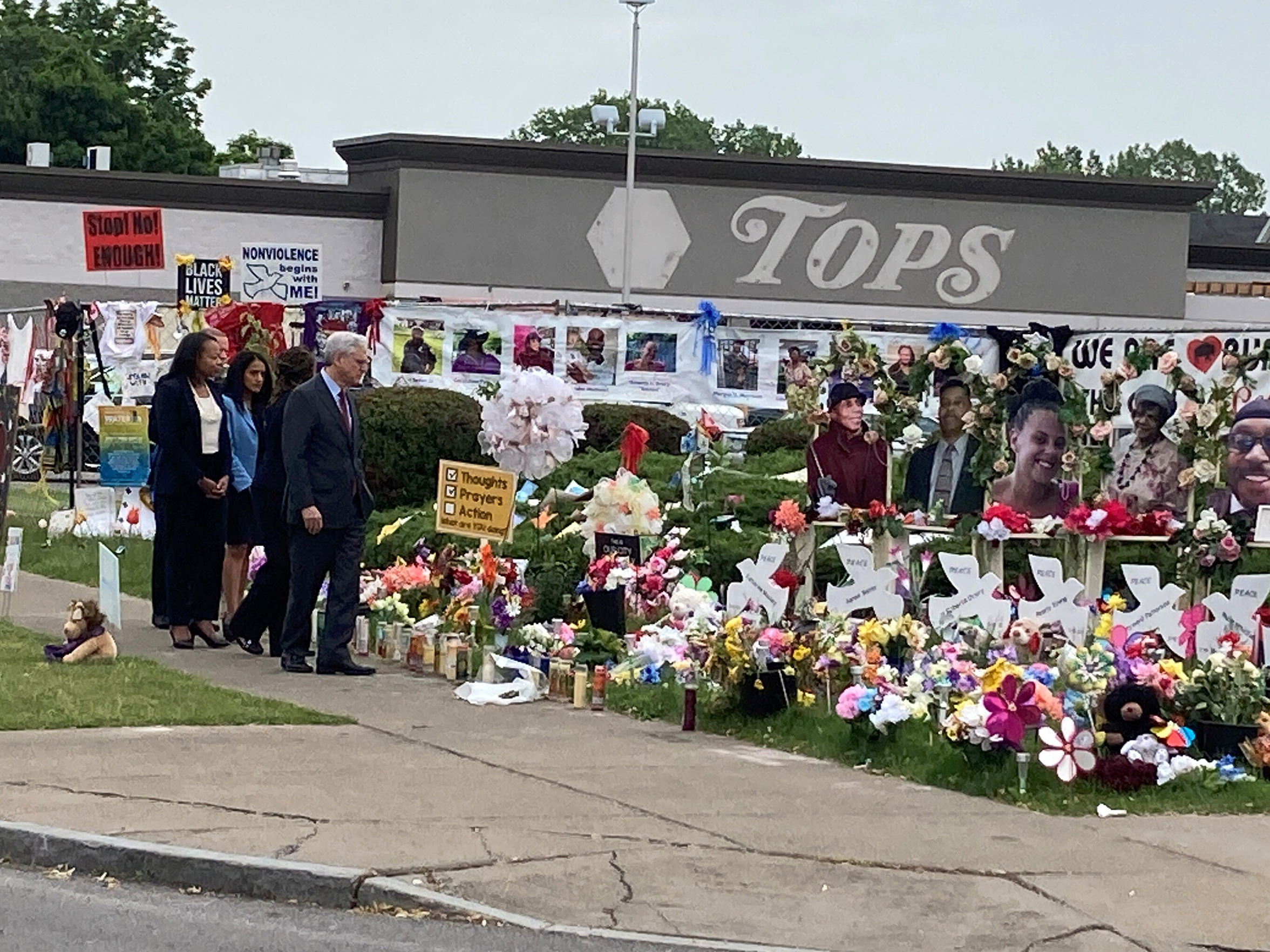 caption: Attorney General Merrick Garland. visits the Tops Friendly Market grocery store in Buffalo, N.Y., on Wednesday, June 15, 2022, the site of a May mass shooting in which 10 Black people were killed.