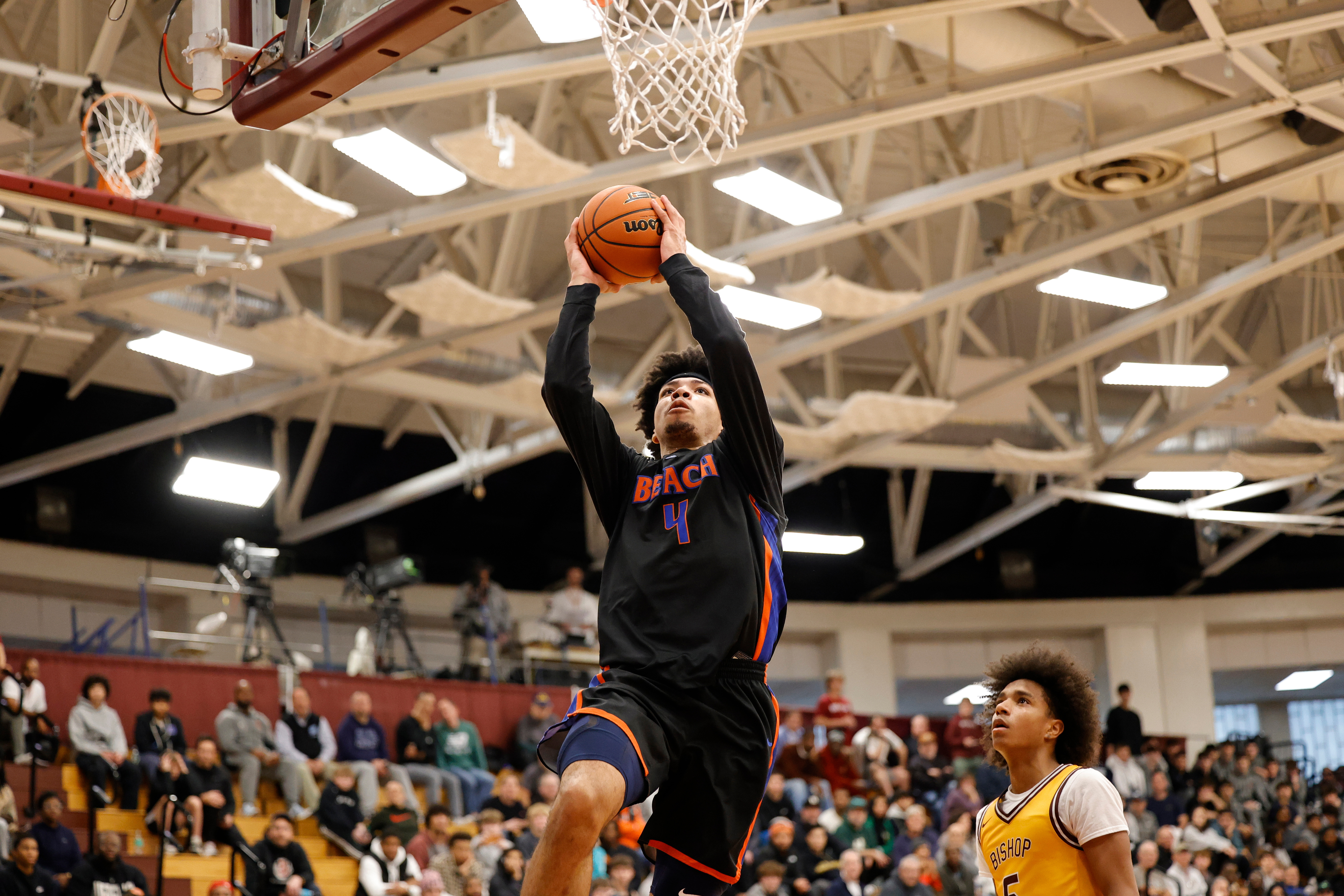 caption: Rainier Beach Tyran Stokes (4) dunks against Bishop McNamara during a high school basketball game at the Hoophall Classic, Sunday, January 18, 2026, in Springfield, MA. 
