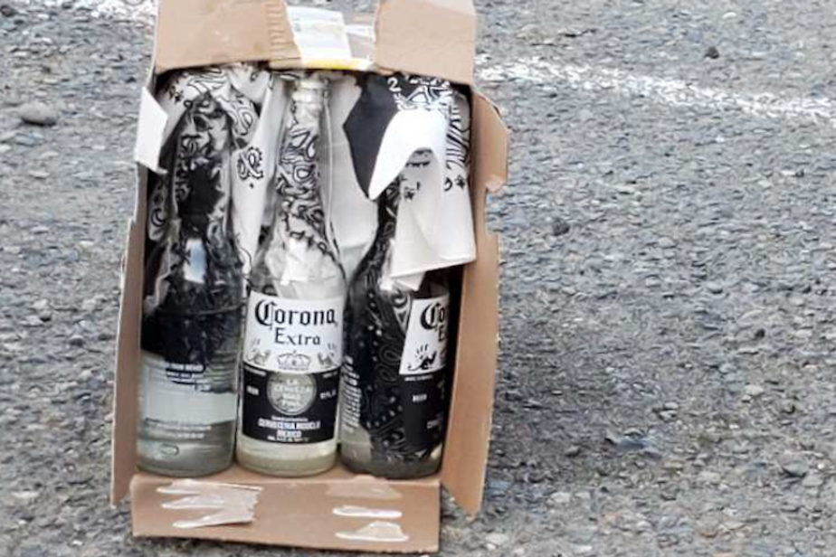 caption: A box of Molotov cocktails that was found outside the headquarters of the Seattle Police Officers Guild after a Labor Day protests, Sept. 7, 2020. 