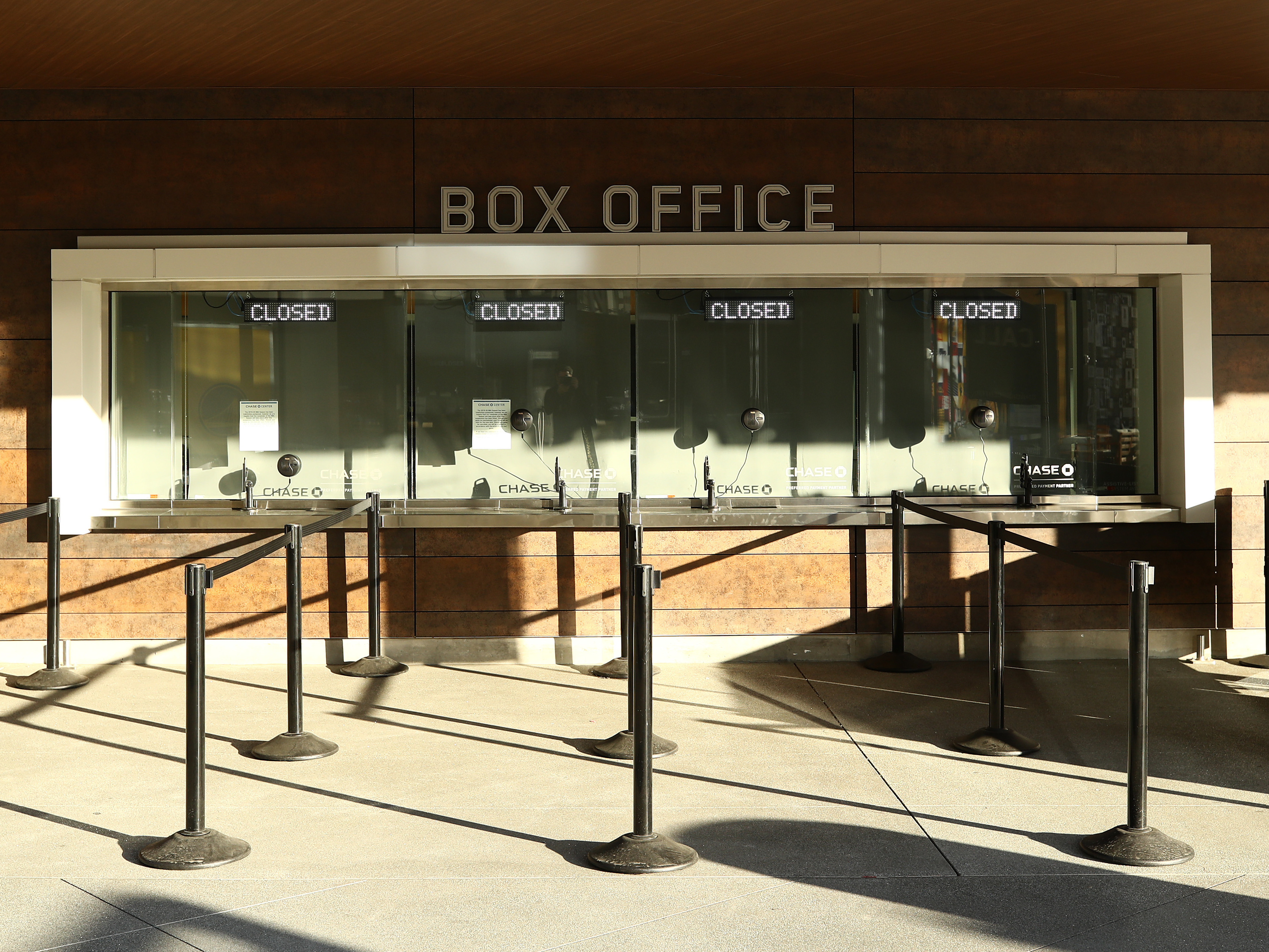caption: A box office is closed at the Chase Center in San Francisco, where the Golden State Warriors were to play the Brooklyn Nets on Thursday. The NBA season has been suspended due to the outbreak of coronavirus.