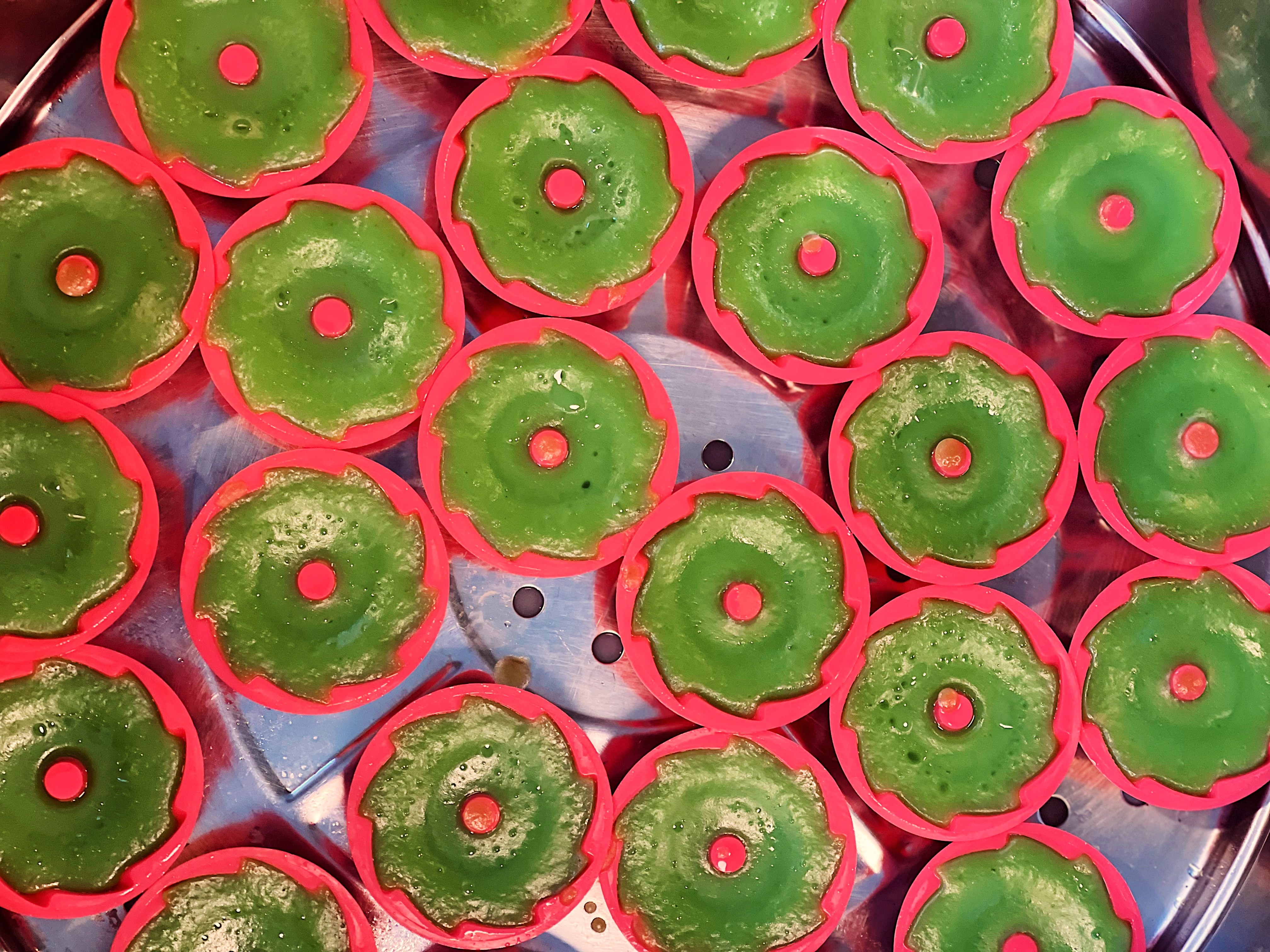 caption: Bright green, floral, and soon to be topped with coconut, this Puteri Ayu is a classic dessert in Malaysia.