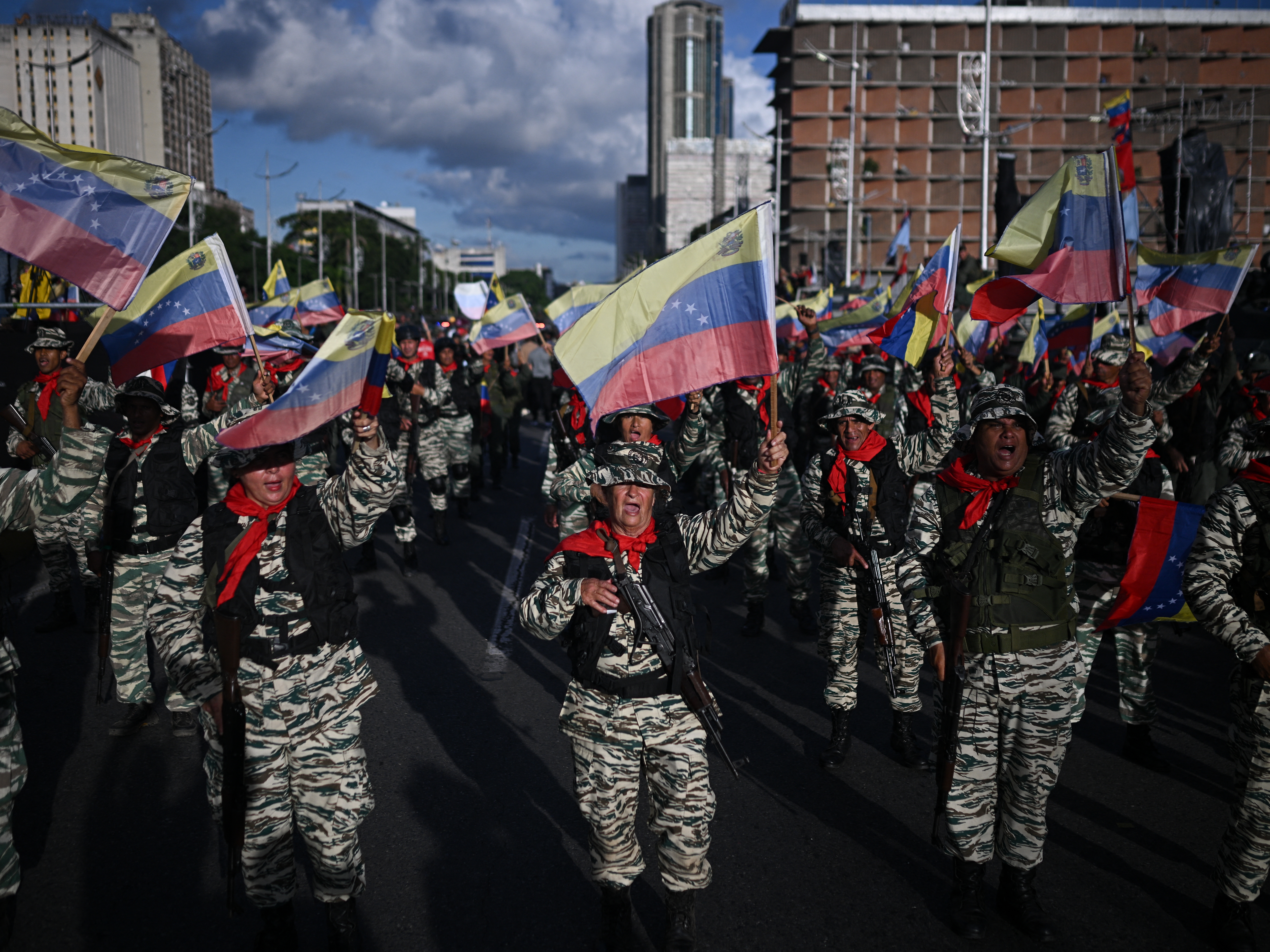 caption: Members of the Bolivarian militia participate in a military deployment in support of Venezuelan President Nicolás Maduro in Caracas, Venezuela, on Sept. 23. Maduro announced he is considering declaring a "state of external commotion" to deal with "aggressions" from the United States.
