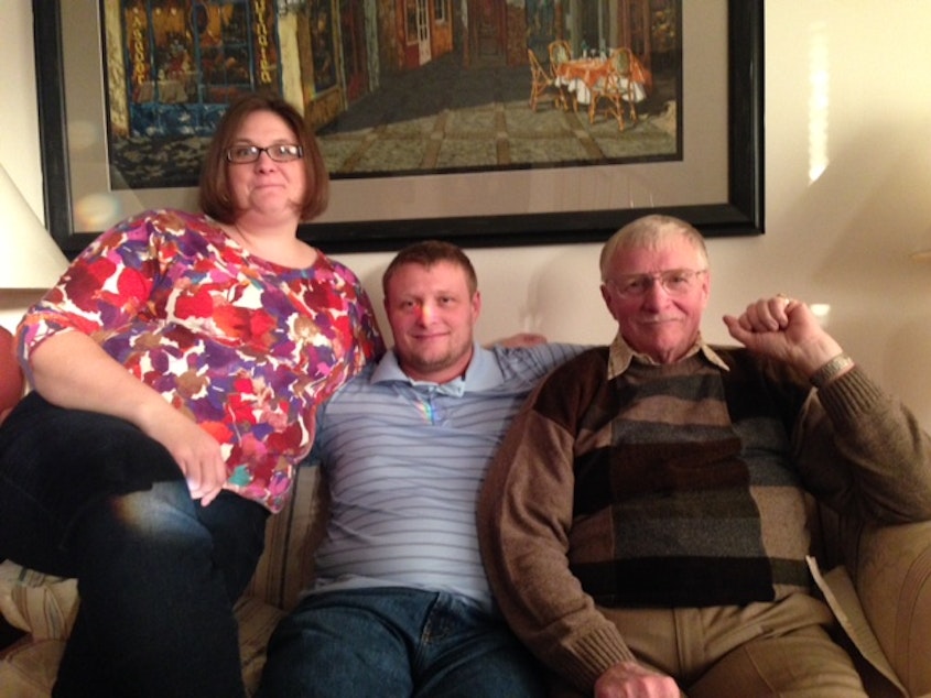 caption: The Simmonds Family: Andrea, her husband Odin (a machinist at Boeing) and his father Don (a former Boeing employee).