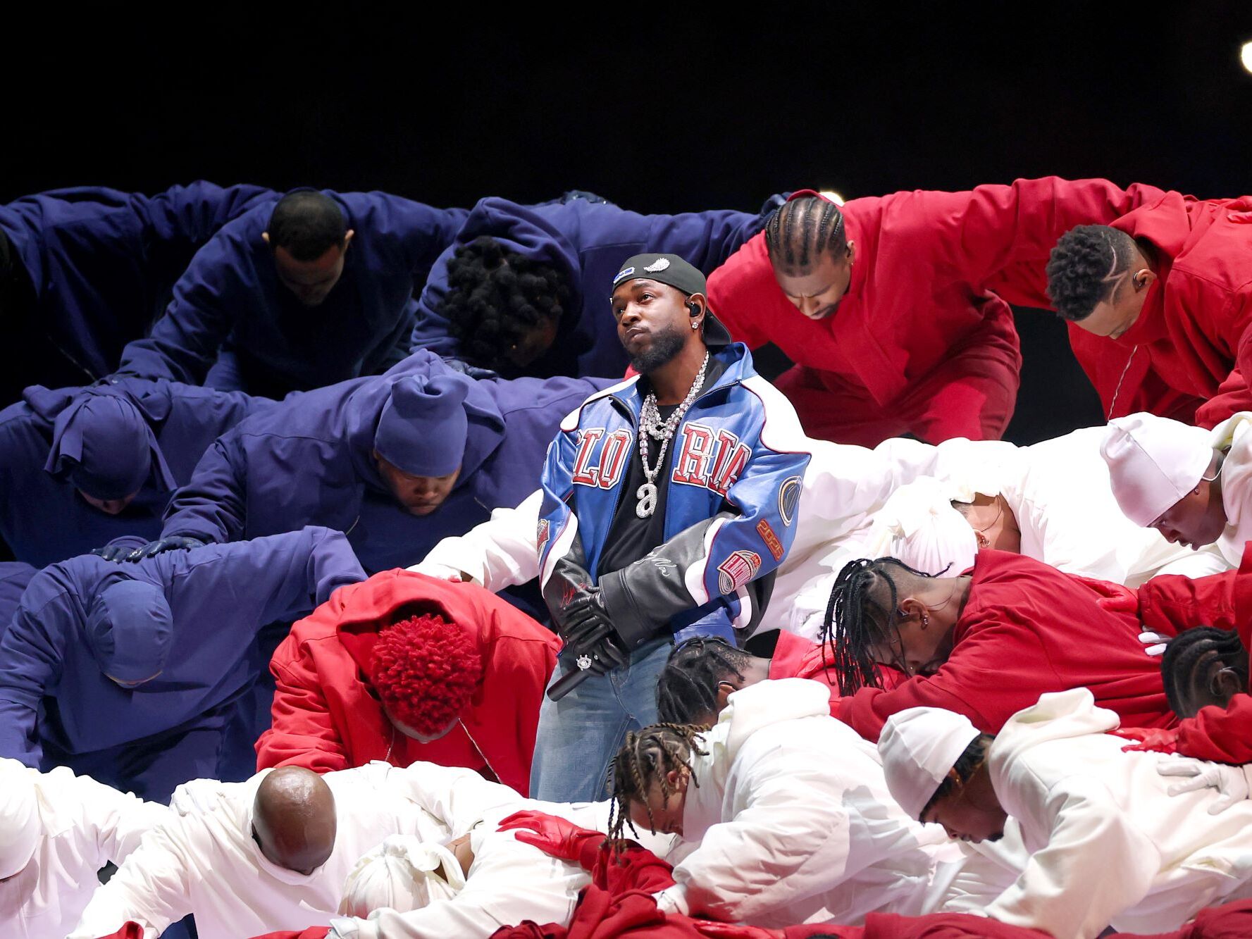 caption: NEW ORLEANS, LOUISIANA - FEBRUARY 09: Kendrick Lamar performs onstage during Apple Music Super Bowl LIX Halftime Show at Caesars Superdome on February 09, 2025 in New Orleans, Louisiana.