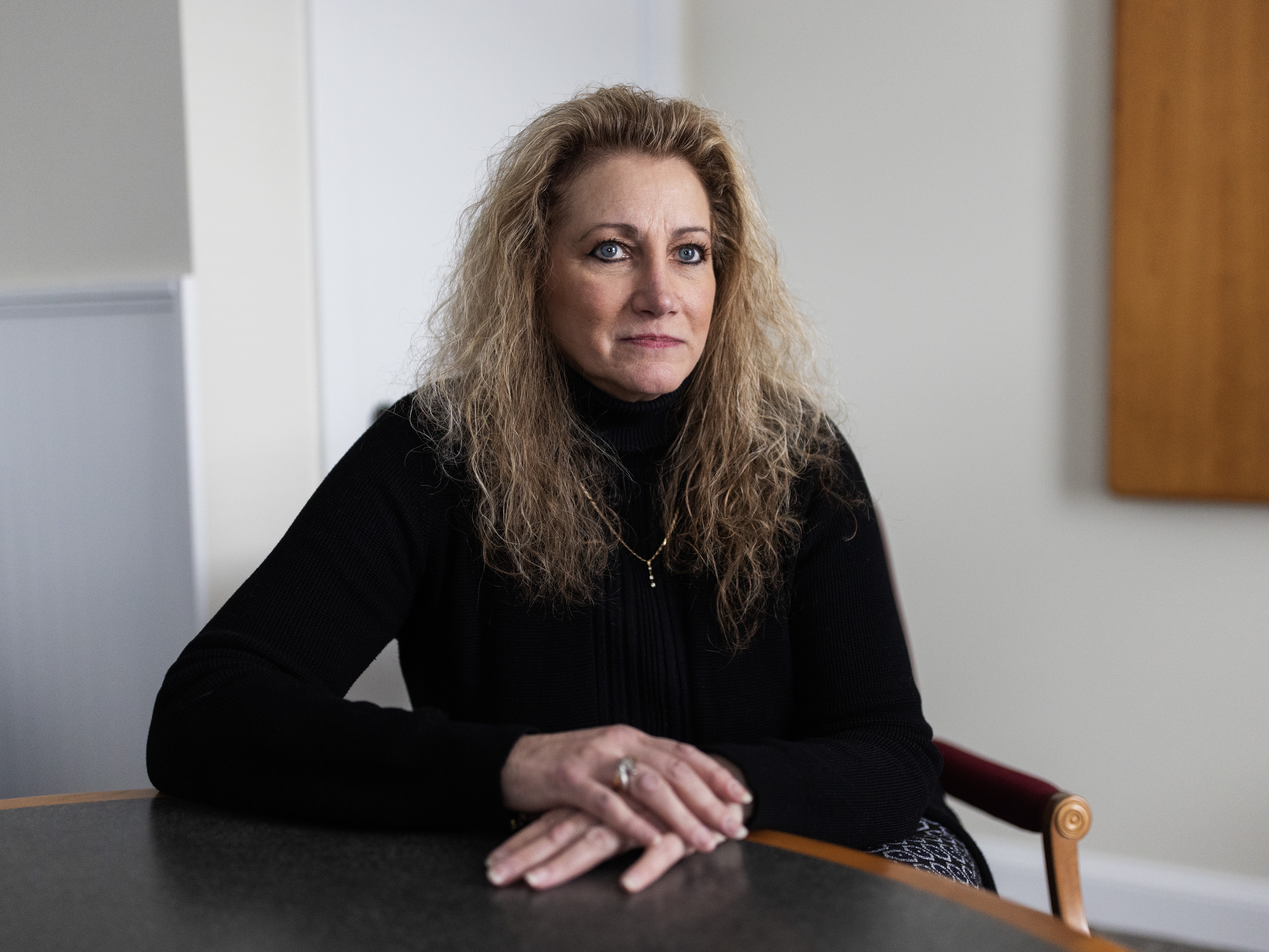 caption: Marlean Ames in her lawyer's office in Akron, Ohio, on Feb. 20. Ames claims she was passed over for jobs because she is a straight woman and that gay people were given positions she was more qualified for.