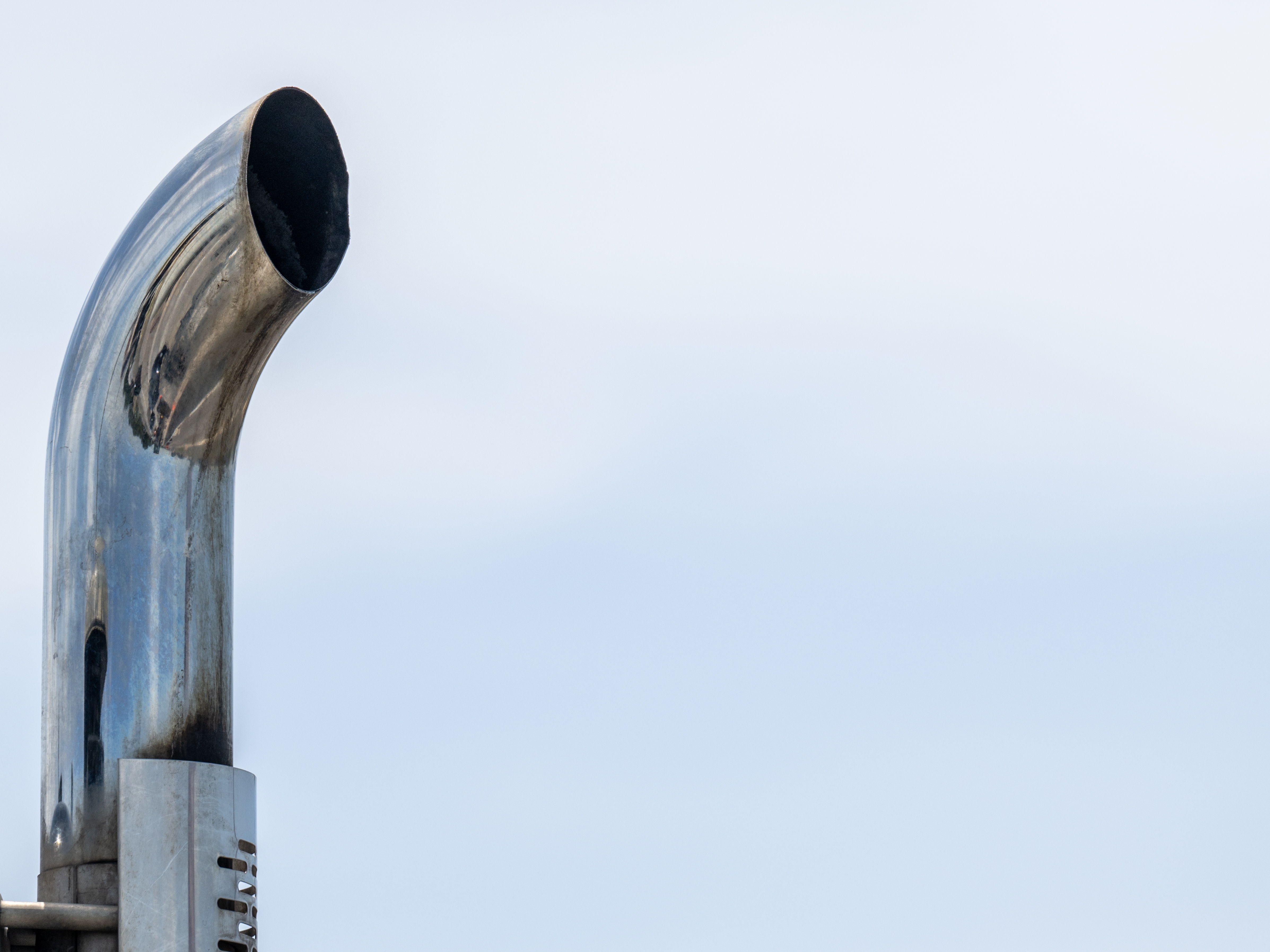 caption: An exhaust pipe atop a truck in Austin, Texas. Under the Trump administration, the Environmental Protection Agency is seeking to repeal past findings that greenhouse gas emissions pose a threat to public health.