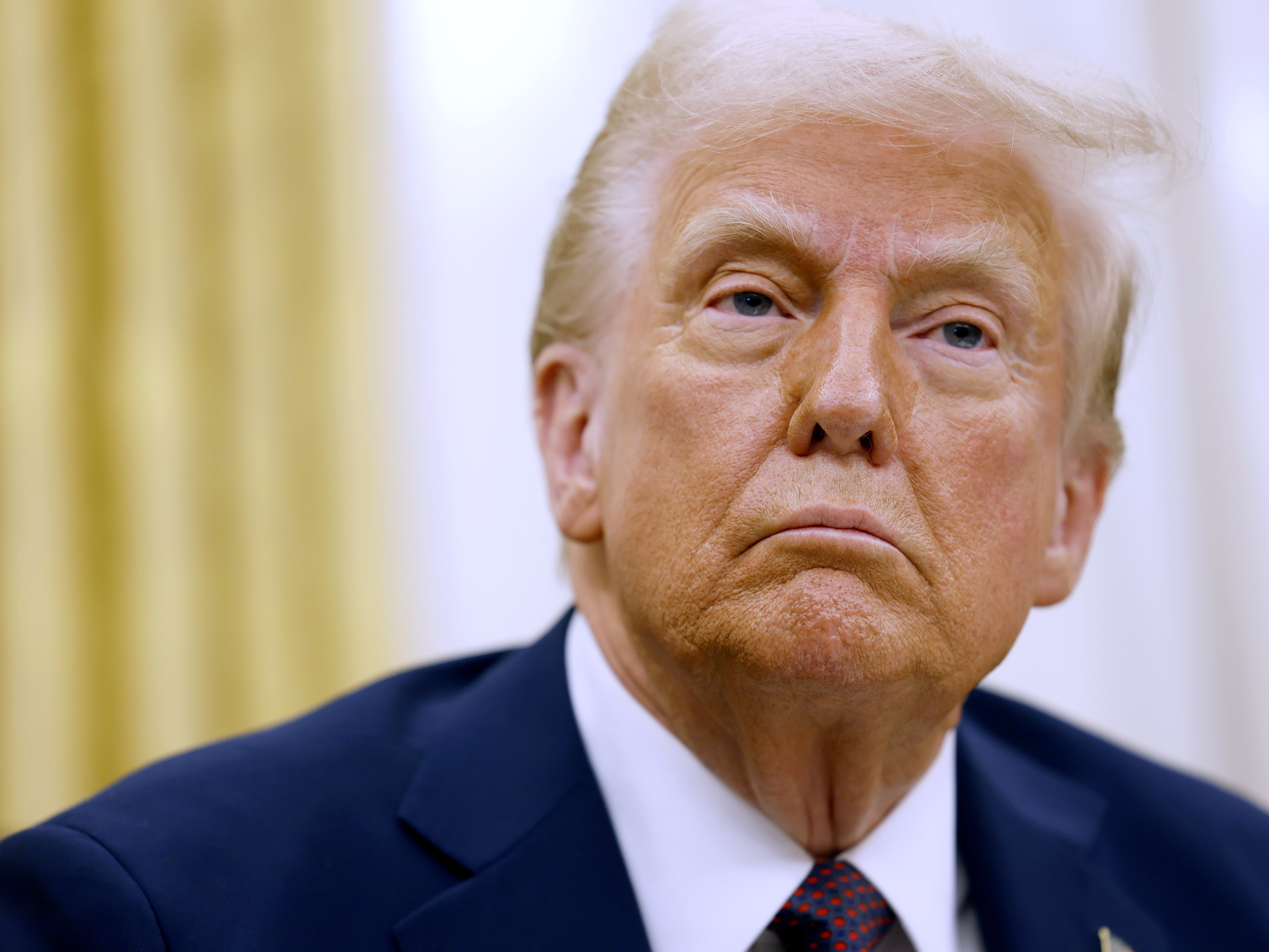 caption: President Trump is seen here after signing a range of executive orders on Jan. 23.