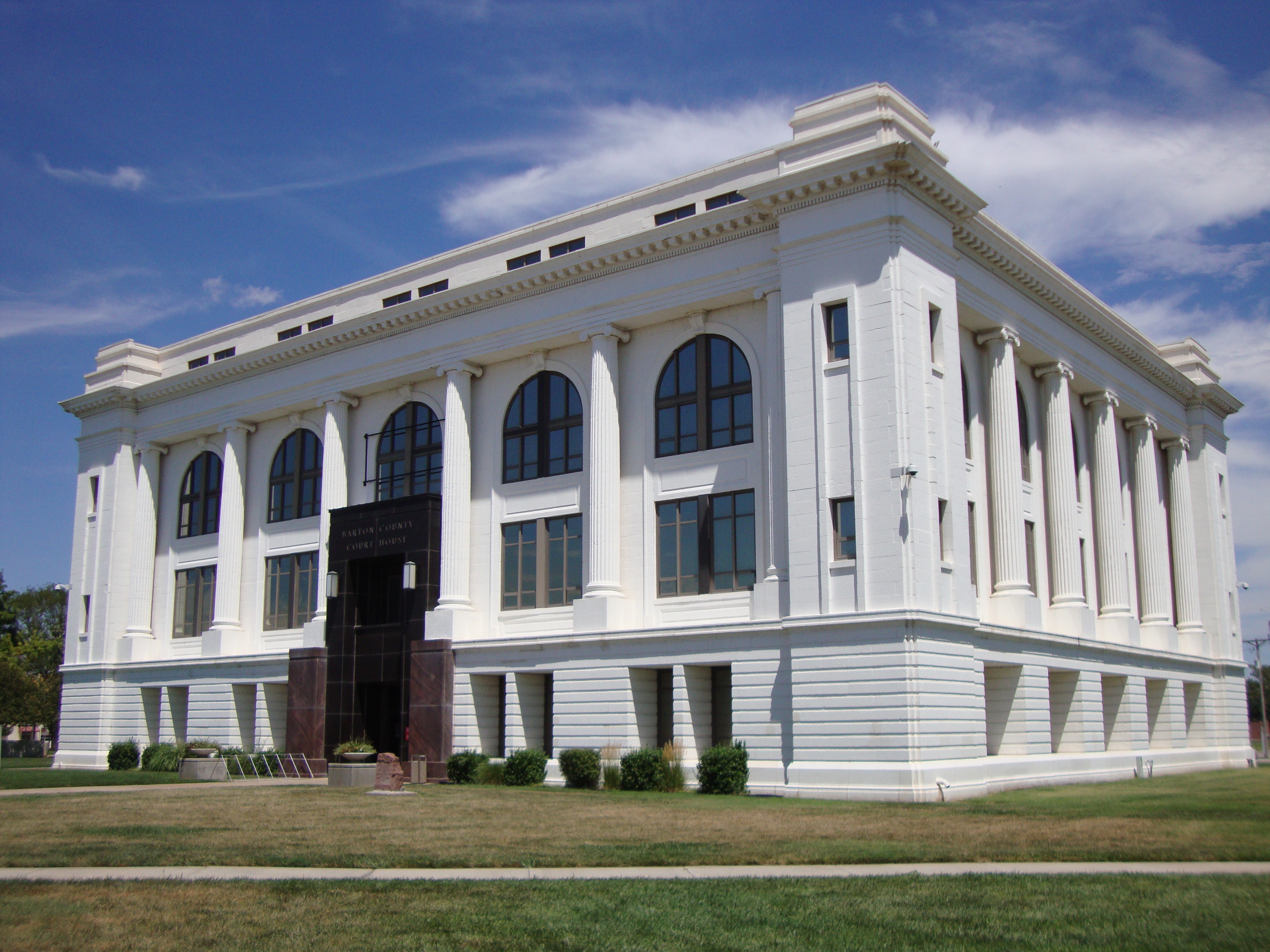 caption: The Barton County Courthouse in Great Bend, Kan. Authorities there say a man was arrested after hiding under a kid's bed.