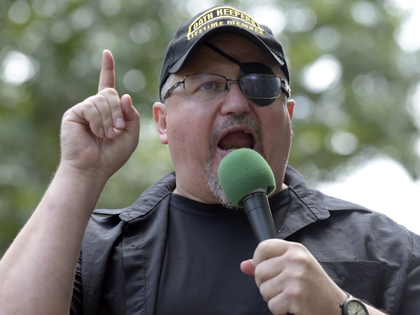 caption: Stewart Rhodes, founder of the Oath Keepers, speaks during a 2017 rally outside the White House.