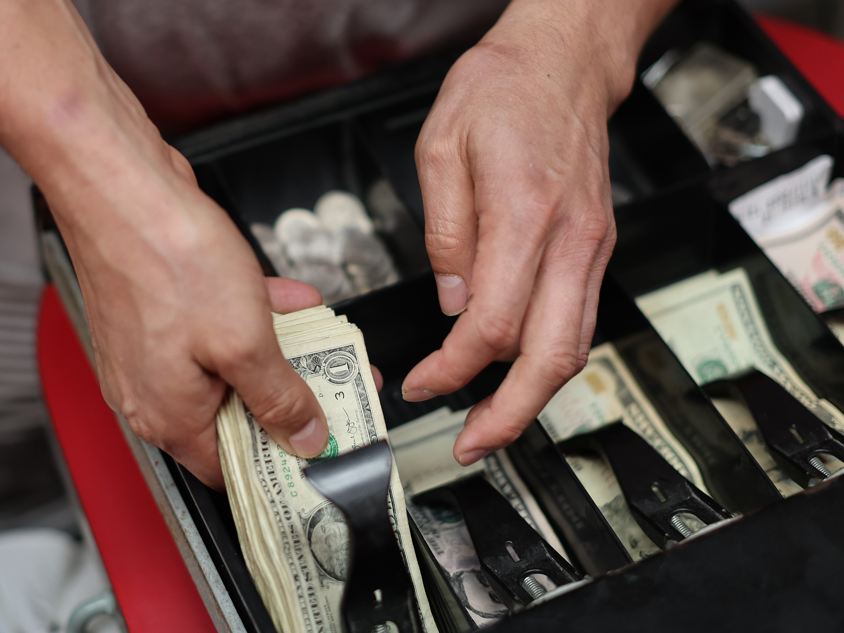 caption: Inflation fell in May to 4%, down from 4.9 percent in April. Some prices, though, continue to rise (Photo by Joe Raedle/Getty Images)