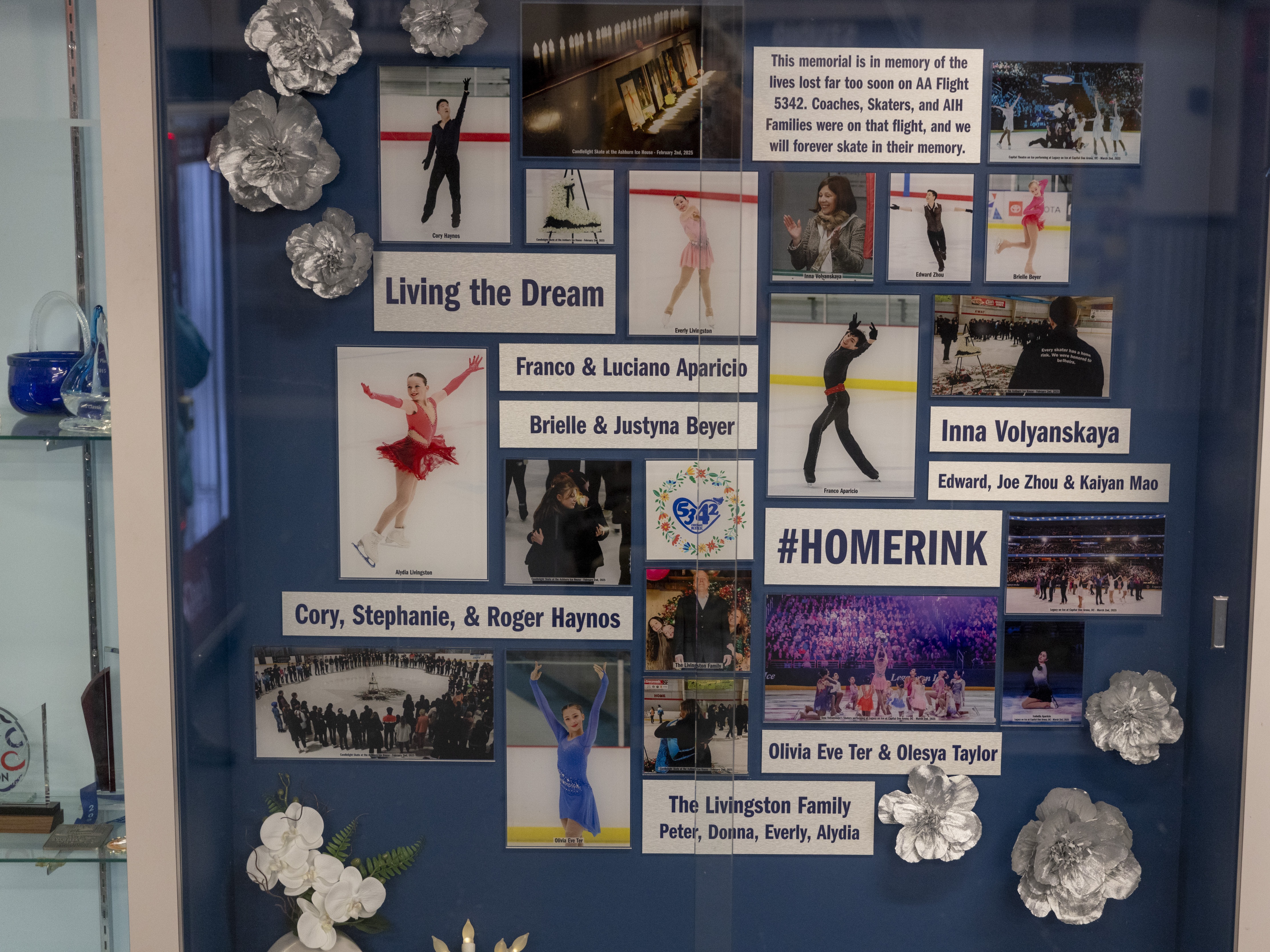 caption: At the Ashburn Ice House, a memorial was created with photos and information honoring a coach, three skaters and their parents who died in the crash.