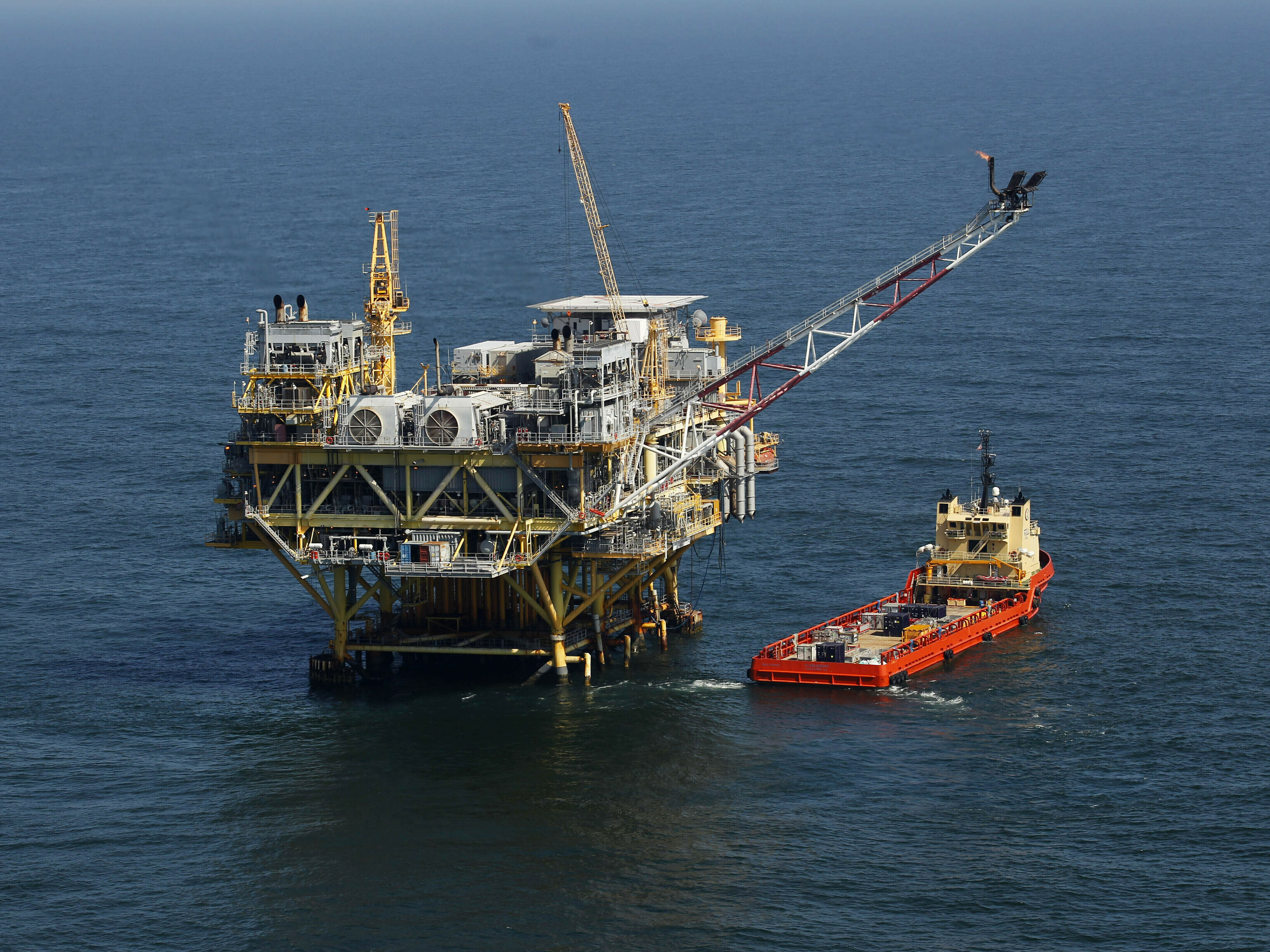 caption: This April 10, 2011, file photo, shows a rig and supply vessel in the Gulf of Mexico, off the coast of Louisiana. The Biden administration has proposed up to three oil and gas lease sales in the Gulf of Mexico over the next five years.