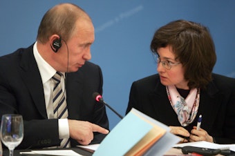 Vladimir Putin speaks with then-economic development and trade minister Elvira Nabiullina in Moscow on October 20, 2008 at a foreign investors advisory council meeting.