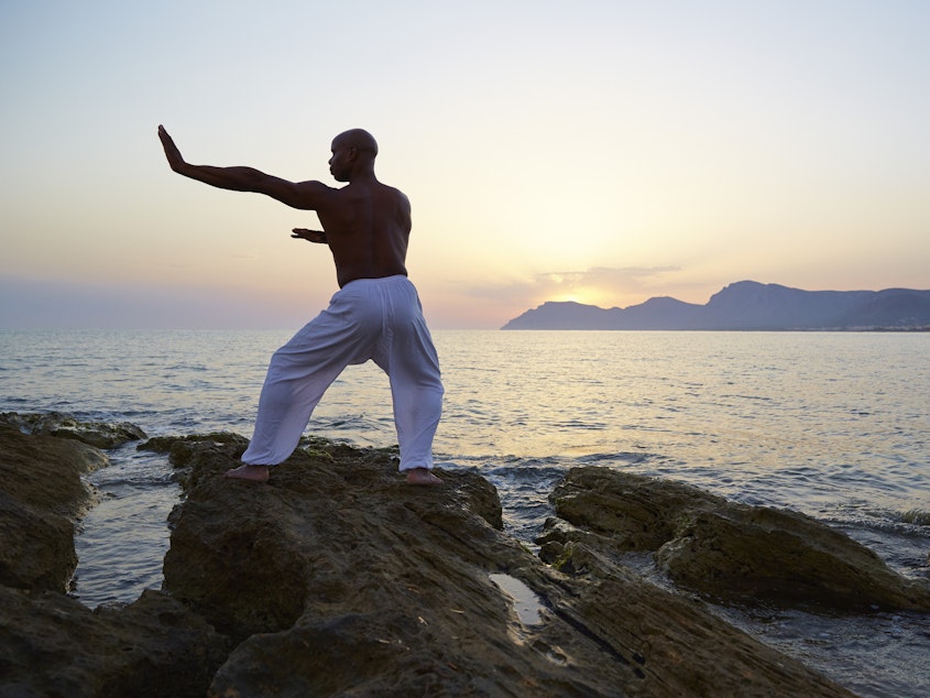 caption: Tai chi has many health benefits. It improves flexibility, reduces stress and can help lower blood pressure.