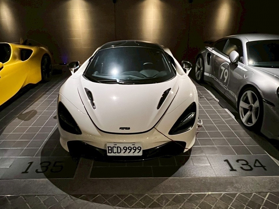 caption: In this photo released by the Ministry of Justice Investigation Bureau, luxury sport vehicles are parked at one of the seized properties which belongs to the suspected head of a criminal scamming syndicate, in Taipei, Taiwan, Tuesday, Nov. 4, 2025.