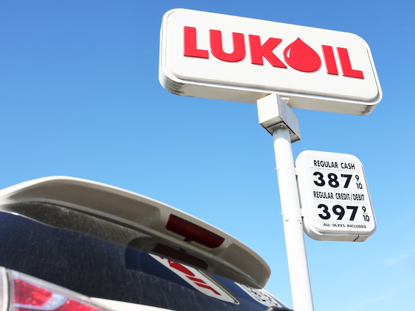 caption: A Lukoil gas station sign is seen Friday in New York City's Brooklyn borough. Lukoil, Russia's second-largest oil company, has called for an end to the war in Ukraine. The oil company is facing calls for boycotts.