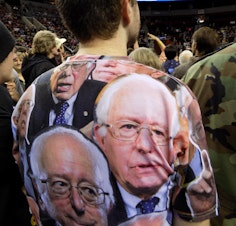 caption: Bernie Sanders supporter wears camouflage shirt to a Sanders rally at the Key Arena, March 20, 2016.