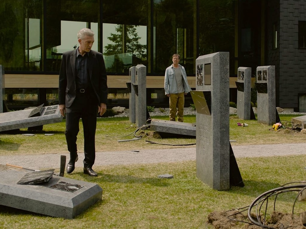 caption: In <em>The Shrouds,</em> Vincent Cassel plays a widower who uses technology to monitor the remains of his dead wife.