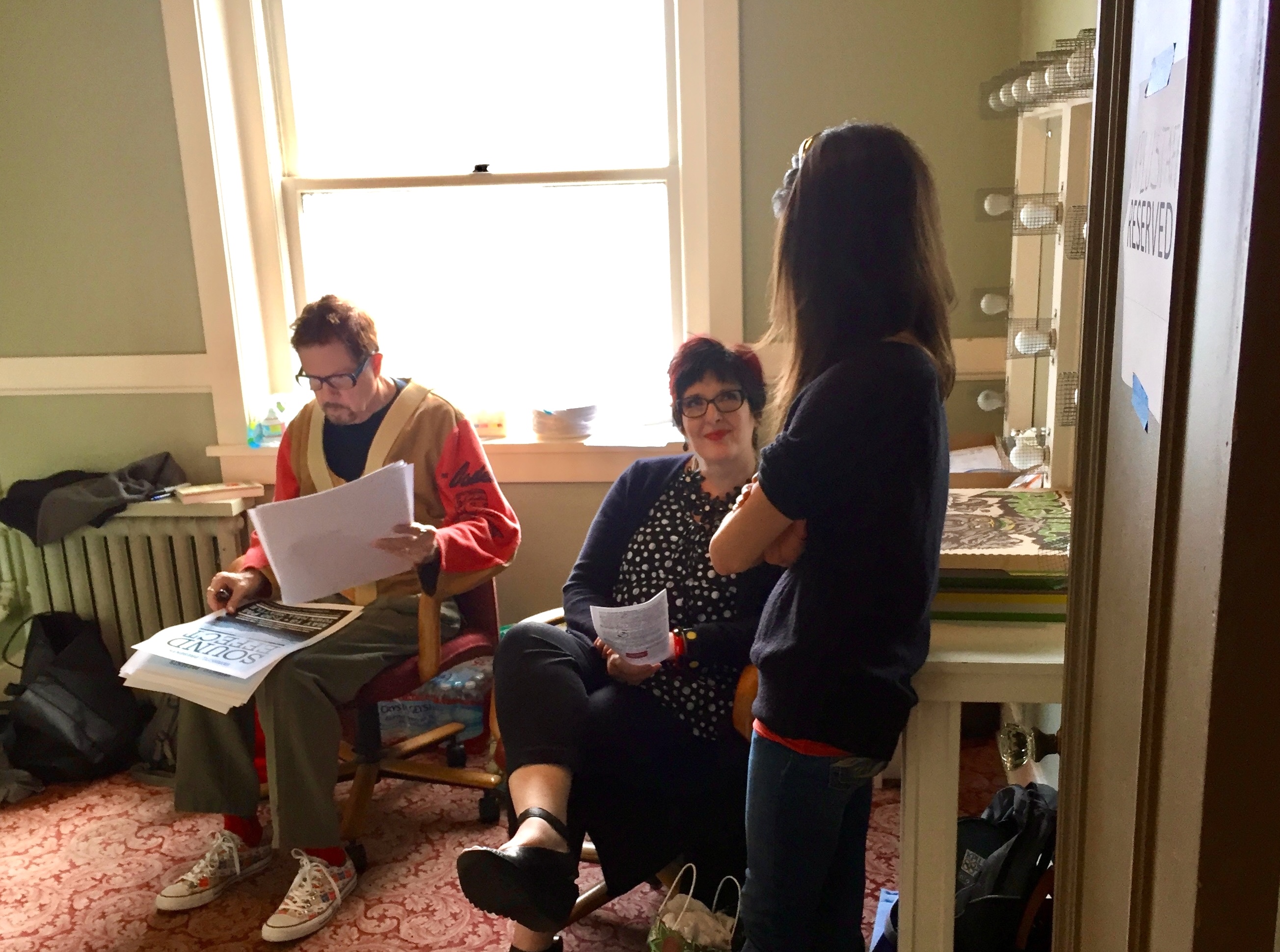 caption: Late novelist Tom Robbins (left), his wife Alexa Robbins (center), and radio host Katy Sewall (right) hang out backstage at Seattle's Town Hall on Wednesday, May 18, 2016.