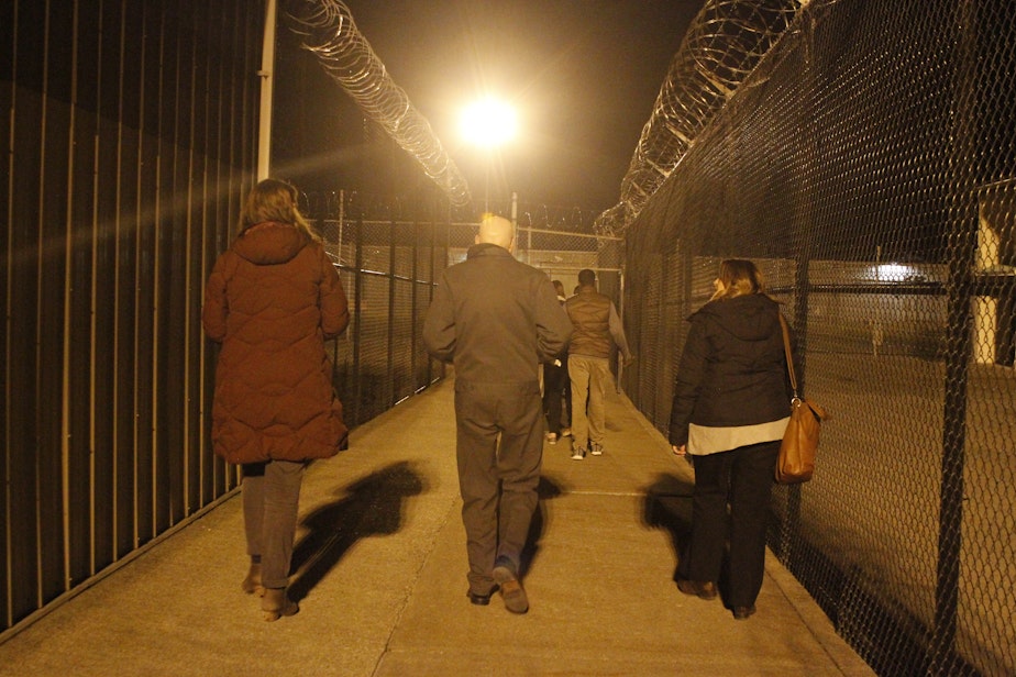caption: Educators and prison officials leave Monroe Correctional Complex after meeting with the Black Prisoners Caucus on March 1, 2019.