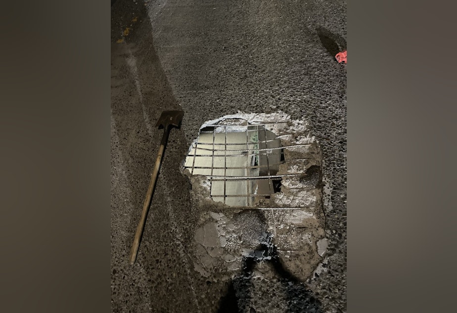 caption: A 4x5 foot hole in an onramp between the West Seattle Bridge and northbound Highway 99 in Seattle. 