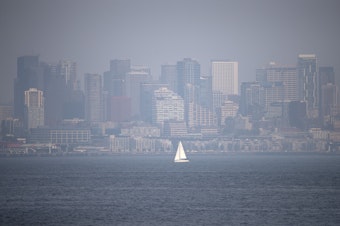 caption: A hazy Seattle skyline is shown on Tuesday, August 14, 2018, from Hamilton Viewpoint Park in West Seattle. 