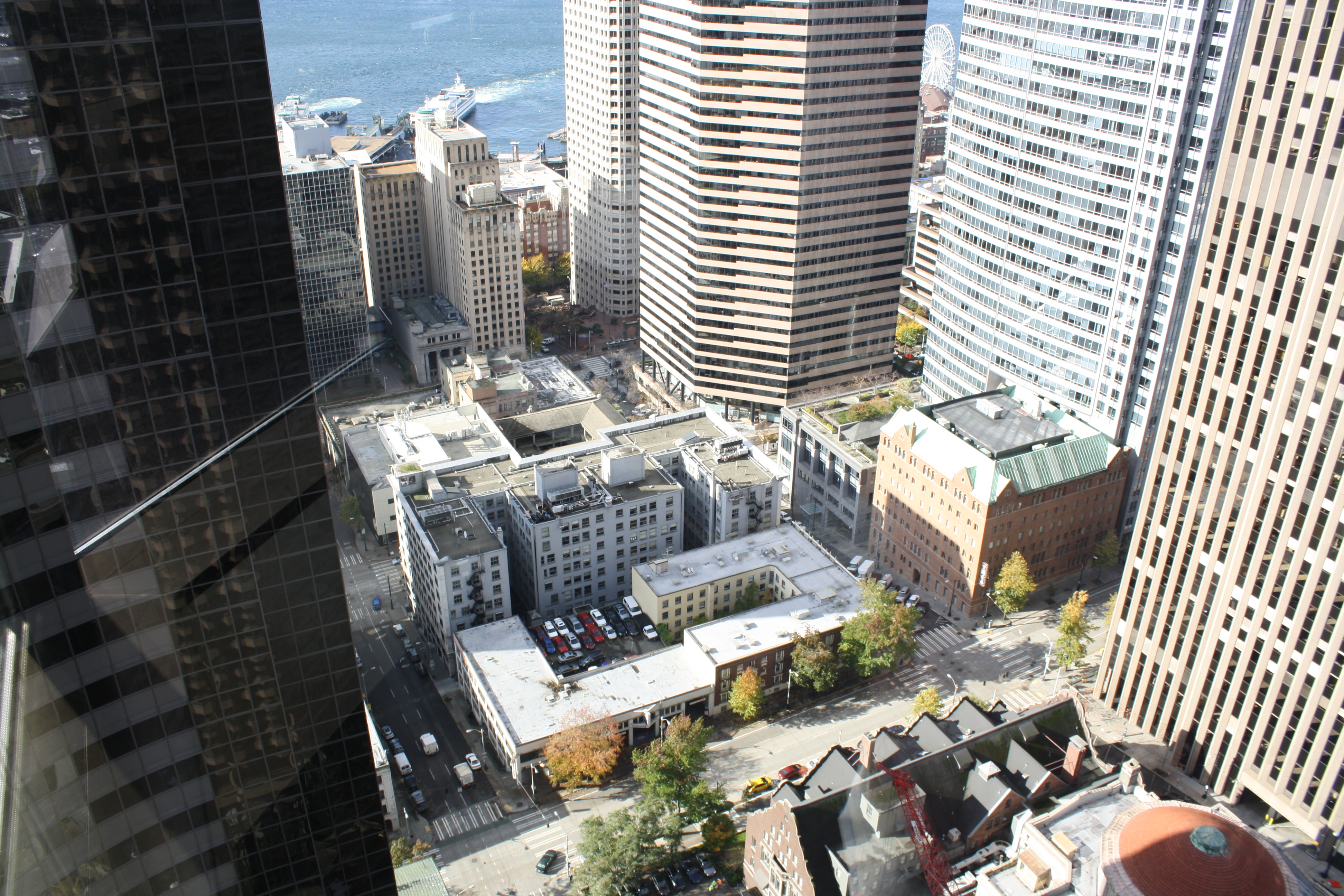 caption: 'Parking cruisers,' people who circle downtown looking for a parking space, are more likely to find parking as rates rise to match demand, according to experts. Seattle's new meters, rolling out in 2015-2016, should bring us closer to demand-based pricing