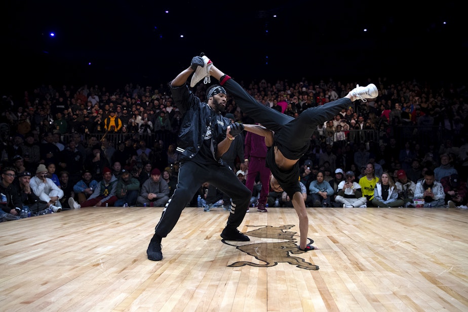 caption: JD "Twixx" Rainey, left, and Jerome "Jeromeskee" Aparis, right, of the Seattle-based crew Massive Monkees, perform during the Red Bull Lords of the Floor competition on Saturday, April 6, 2024, at WAMU Theater in Seattle. 