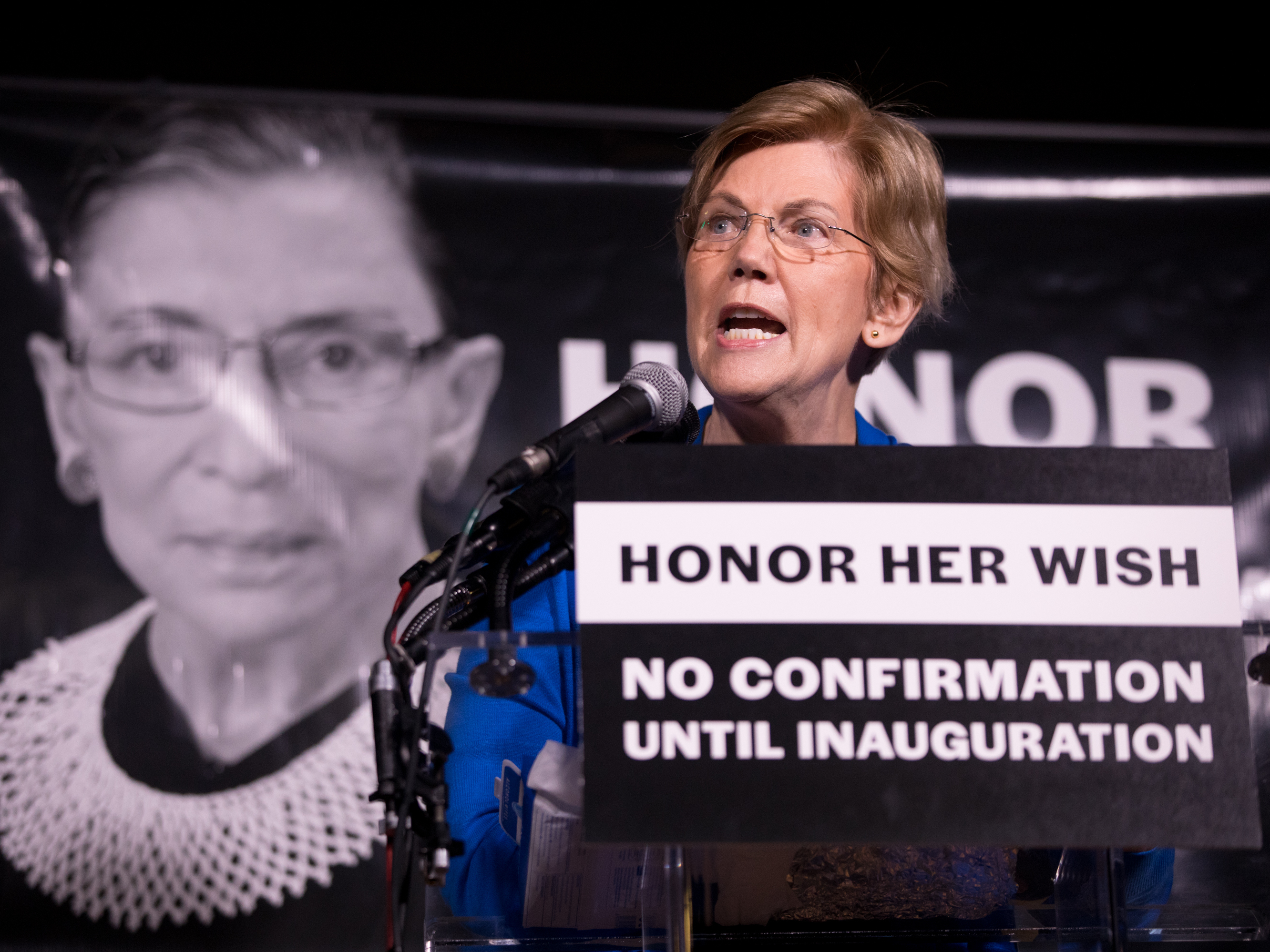 caption: Sen. Elizabeth Warren, D-Mass., rallies the crowd of 2,500 people during a vigil Saturday night for Justice Ruth Bader Ginsburg in Washington, D.C.