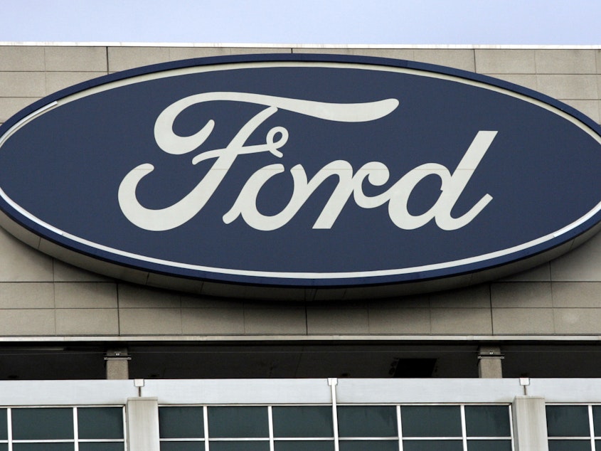caption: About 7,000 white-collar jobs are being eliminated as part of Ford's massive organizational restructuring. The automaker says it will save $600 million per year as a result.