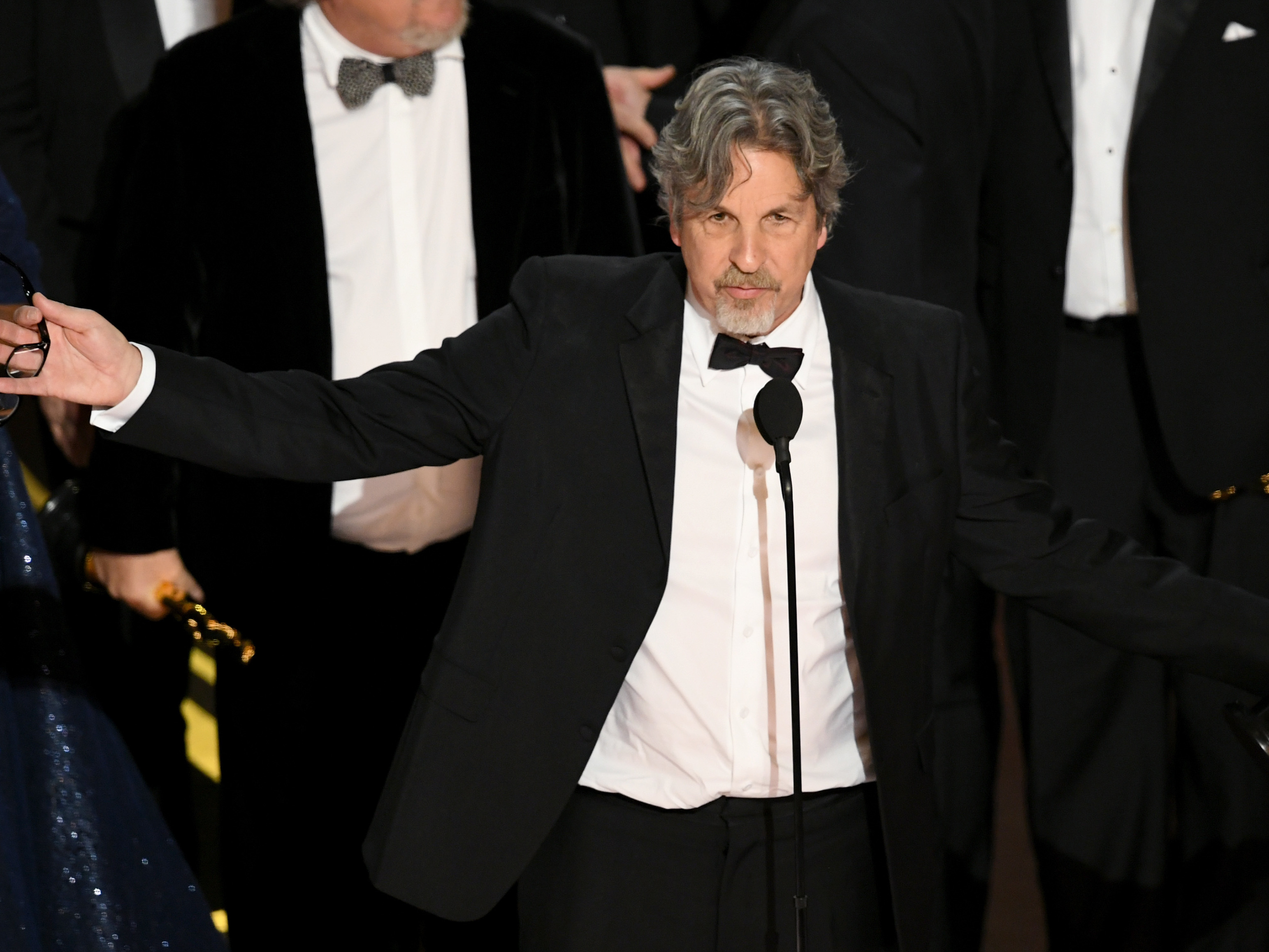 caption: Peter Farrelly accepts the Best Picture award for 'Green Book' onstage during Sunday's Academy Awards.