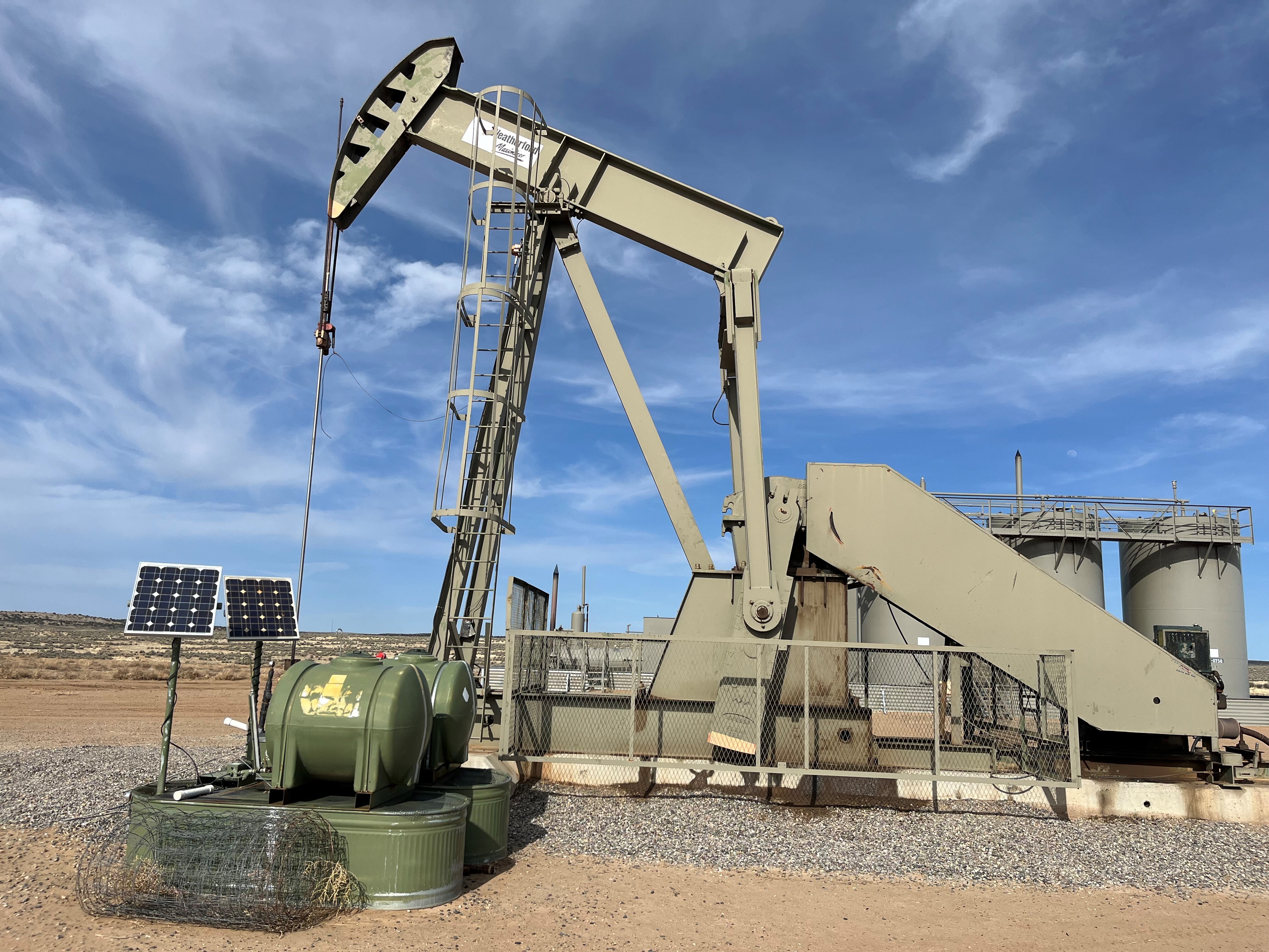 caption: A pump jack in New Mexico's San Juan Basin. This is one of the country's oldest federal lands drilling areas. Many oil company executives celebrated Donald Trump's return to the White House. But now expectations of higher profits are fading amid fears of a recession.