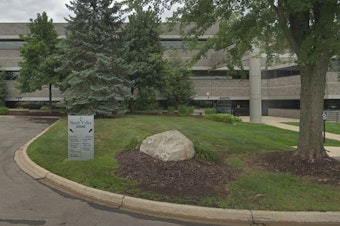 caption: The "University of Farmington" occupied office space in this building in Farmington Hills, Mich. In court documents, eight men are accused of recruiting hundreds of "students" to the bogus school.